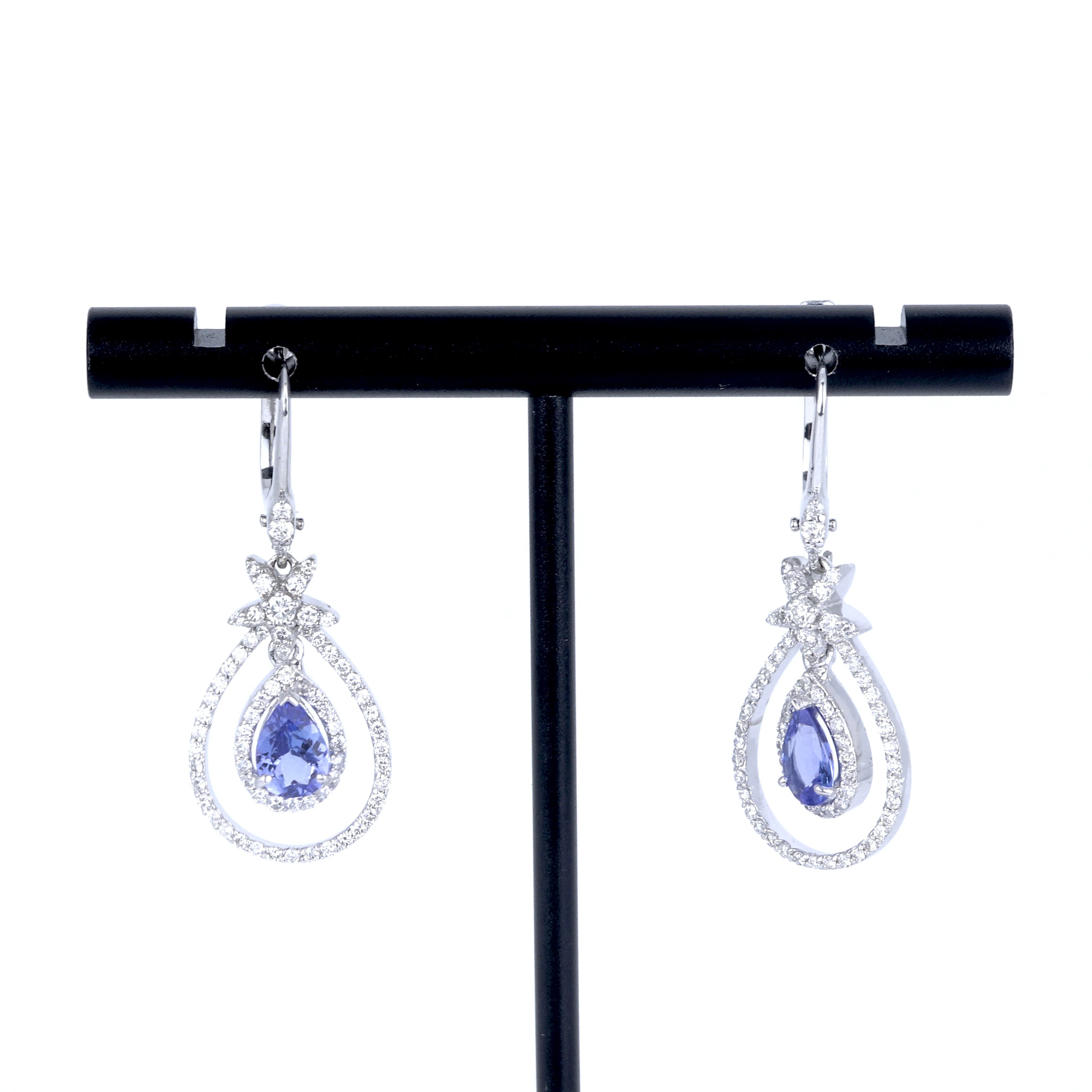 18CT GOLD TANZANITE & DIAMOND EARRINGS.
