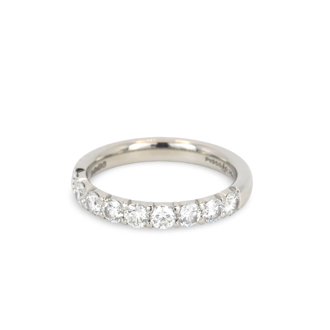 PLATINUM DIAMOND HALF ETERNITY RING.
