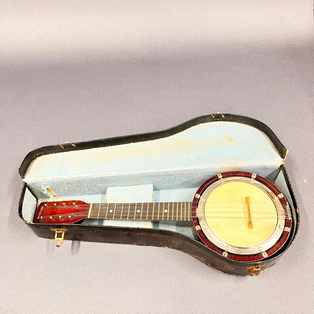 CASED BANJO.