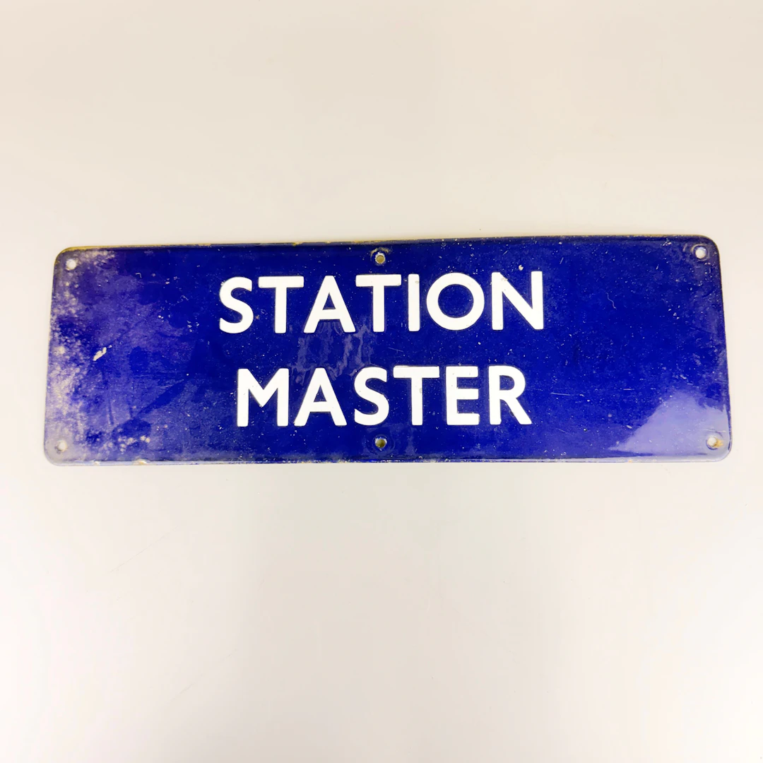 ENAMELLED METAL STATION MASTER SIGN.