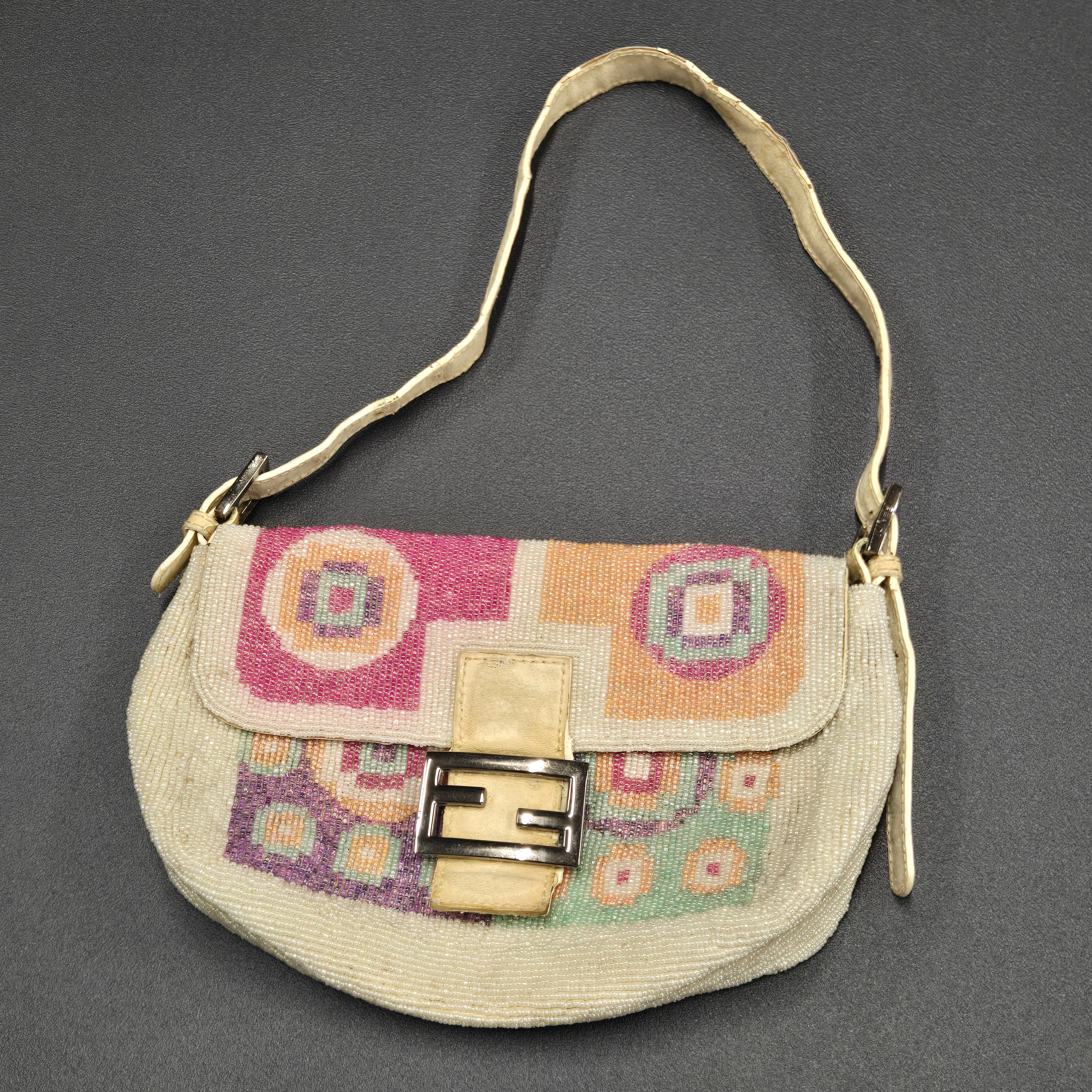 FENDI BAGUETTE BEADED HAND BAG.
