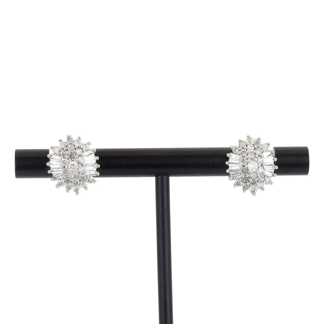 9CT GOLD DIAMOND EARRINGS.