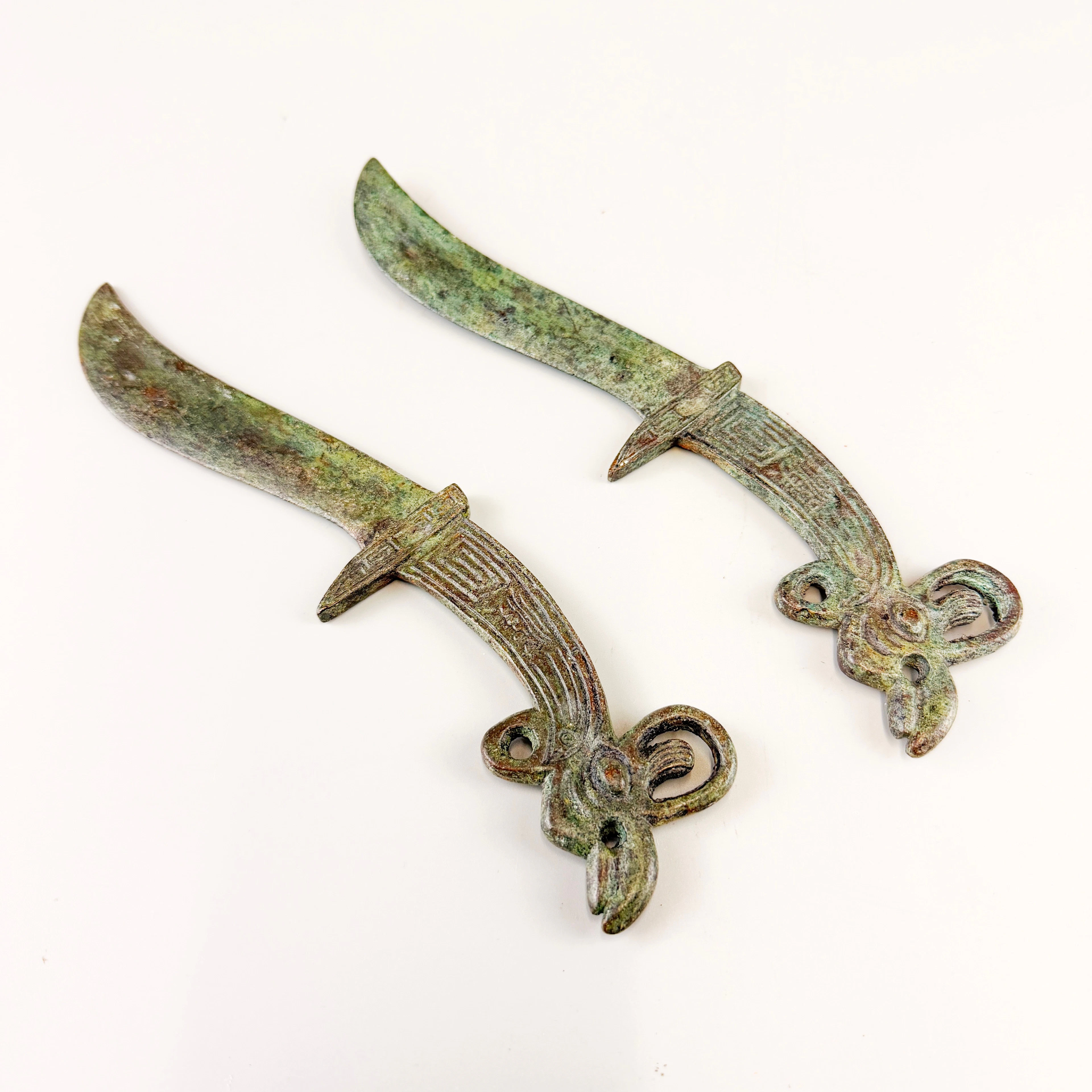 BRONZE ORIENTAL DAGGERS.