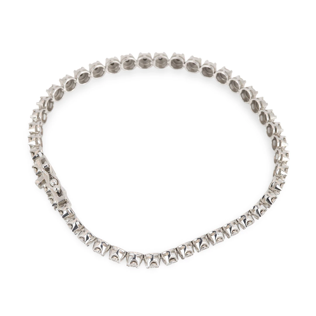 14CT GOLD DIAMOND TENNIS BRACELET.