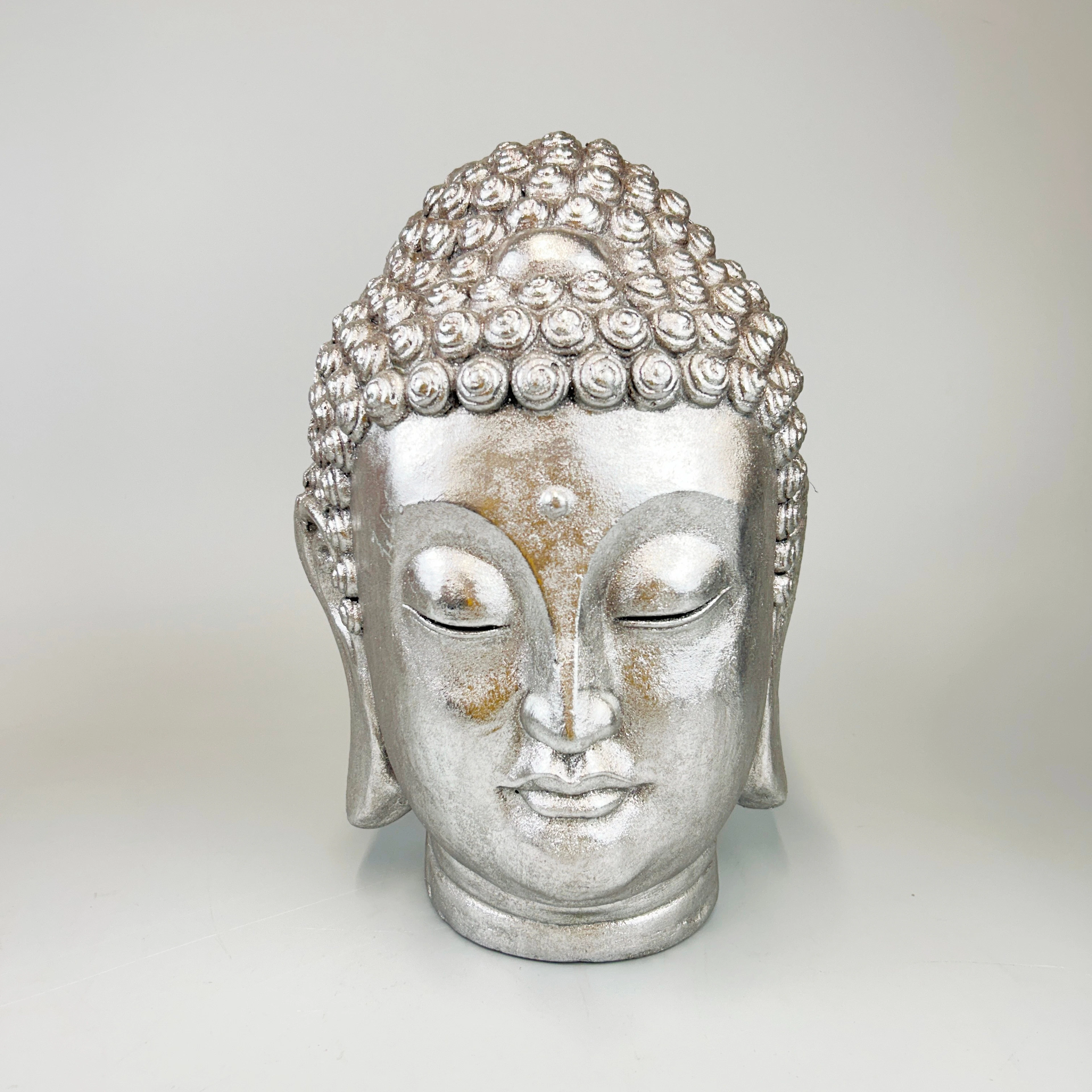 SILVERED COMPOSITION BUDDHA HEAD.