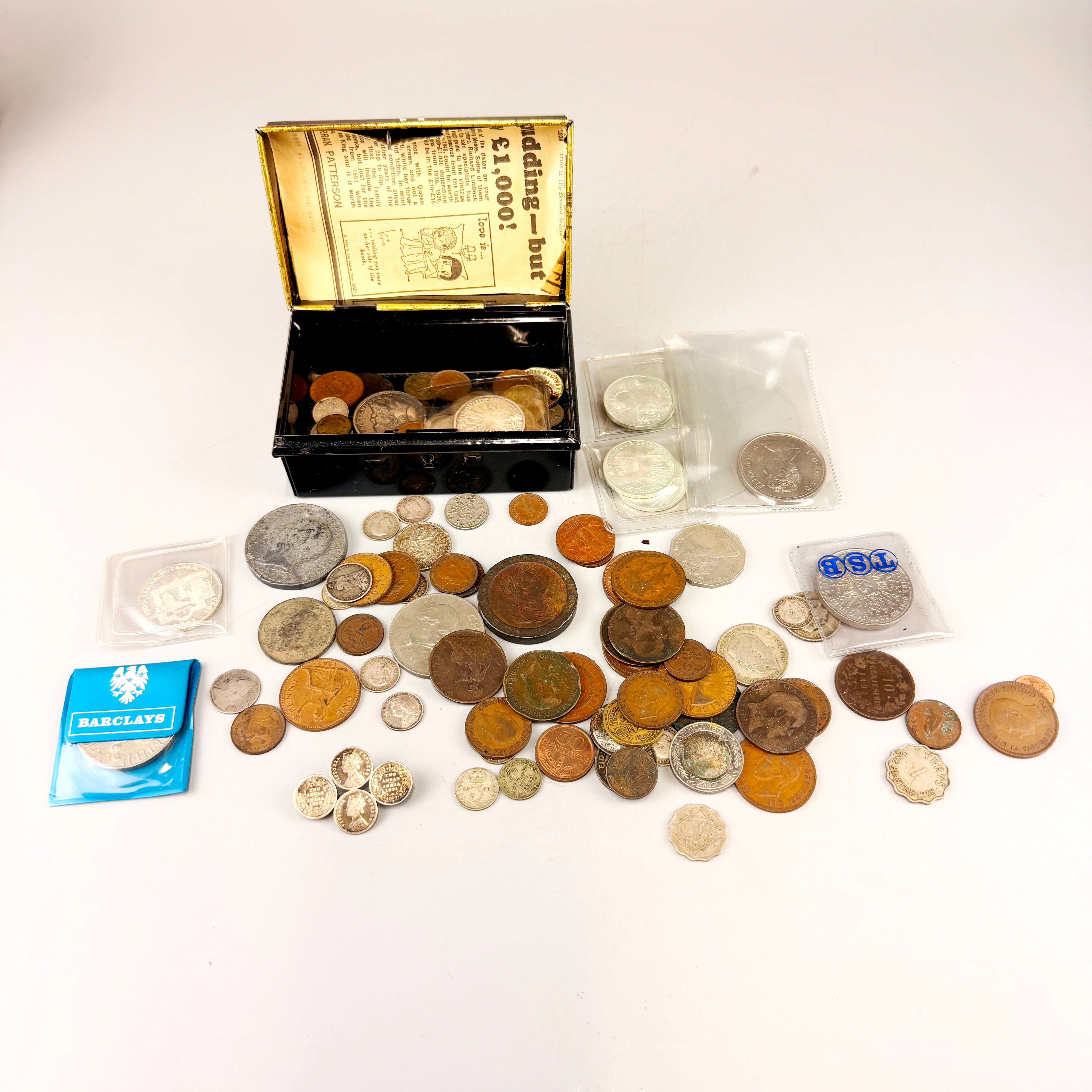 TIN OF COINS.