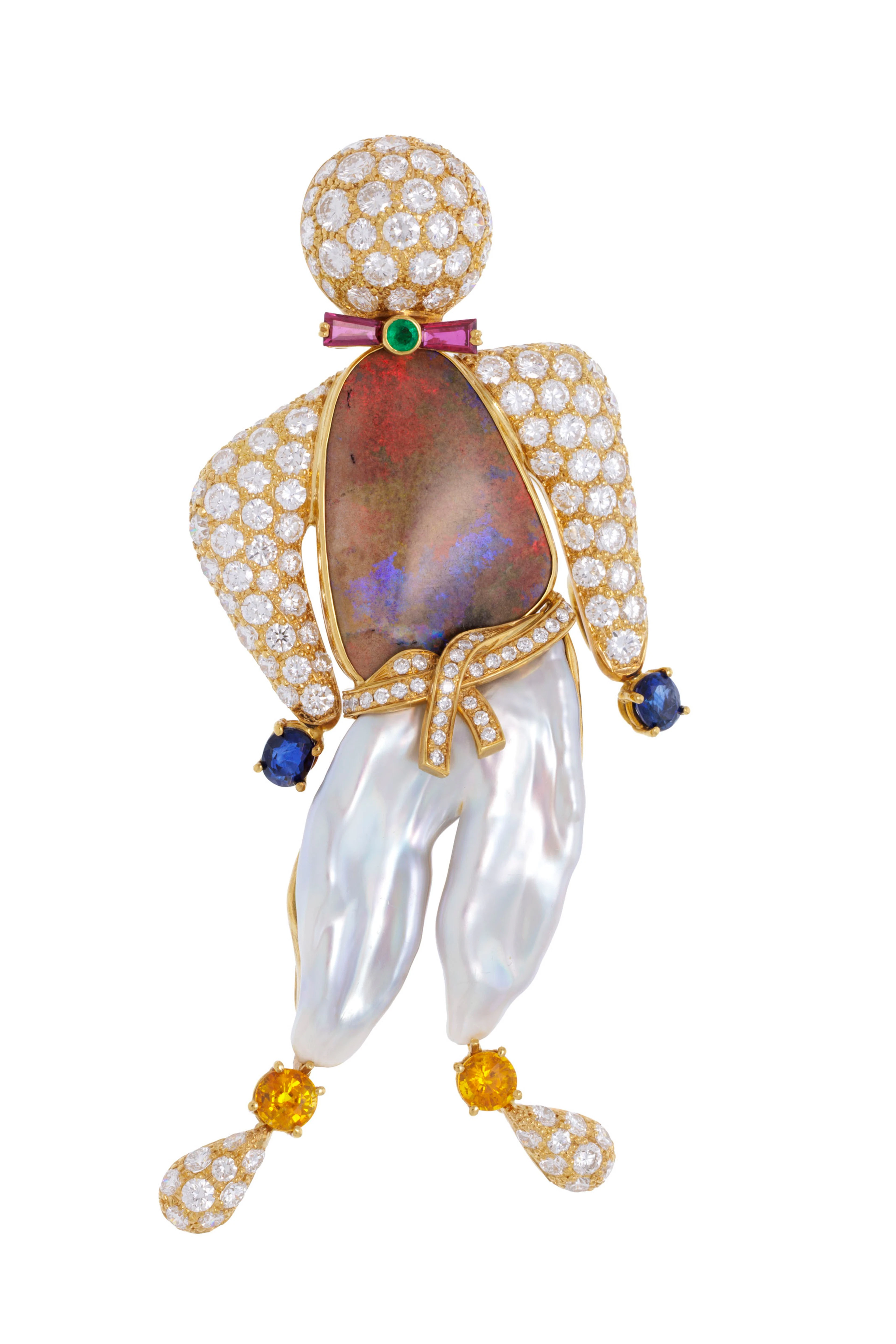Ludwig Muller, broche or 750 stylisant un personnage formé d'une perle