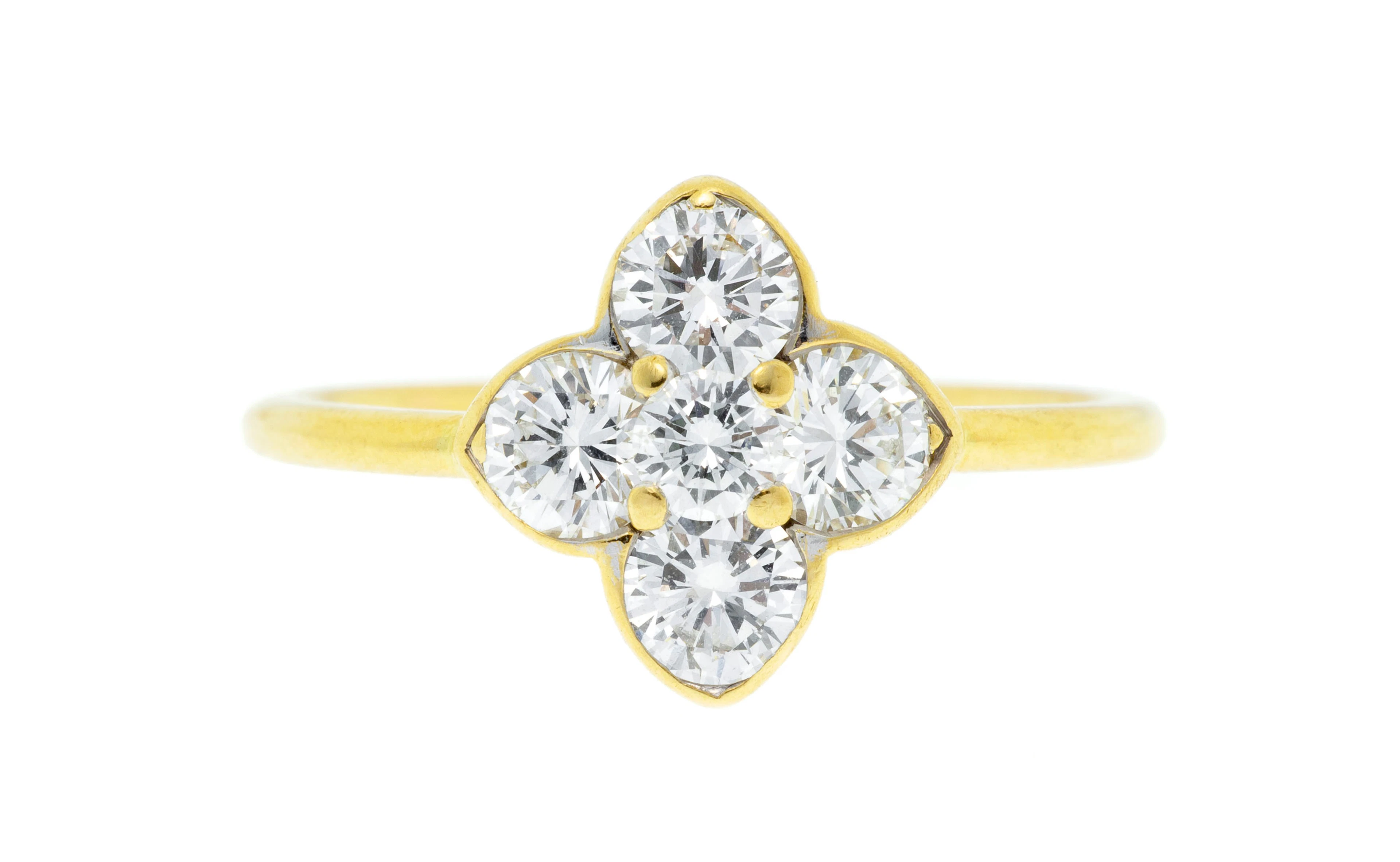 Bague or 750 centrant un élément quadrilobé serti de diamants taille