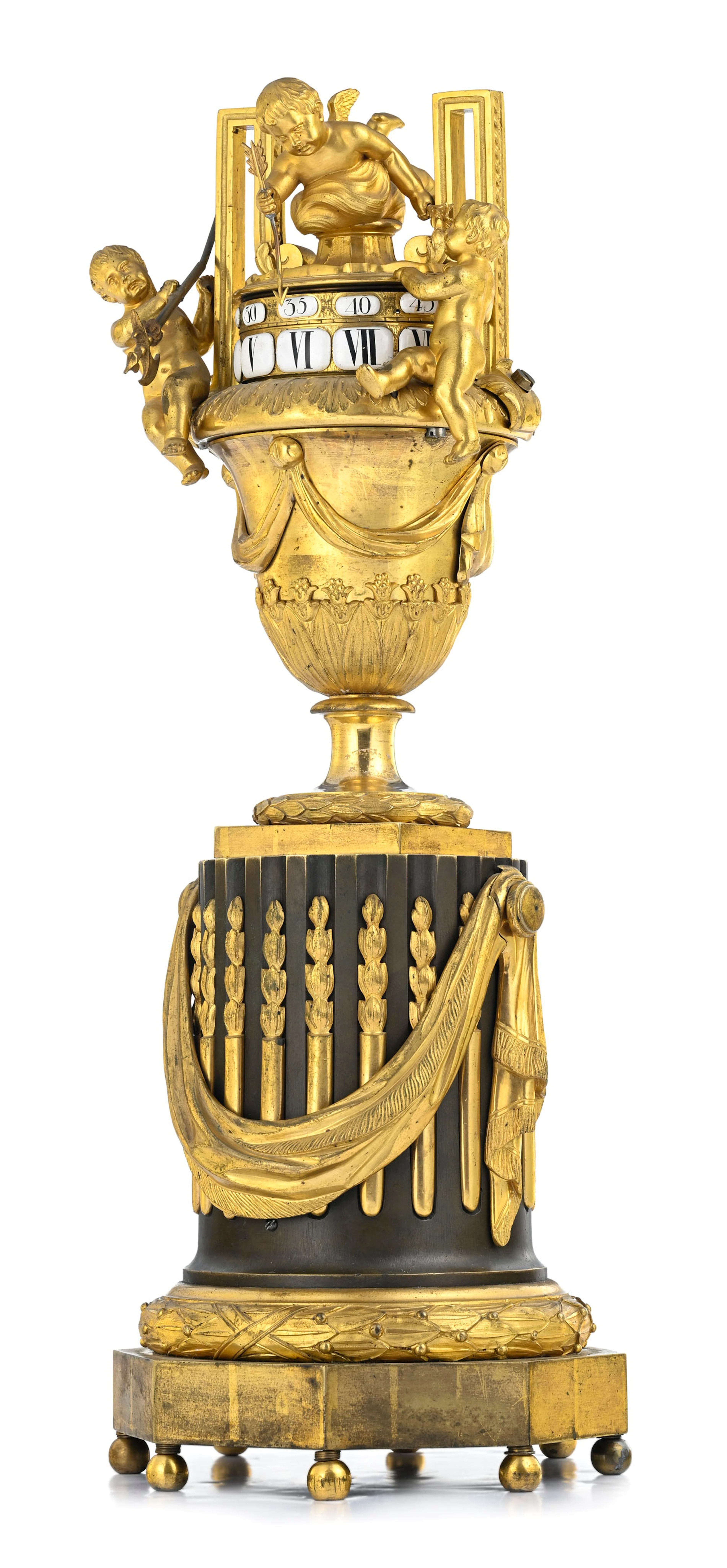 Pendule urne à cadrans tournant d'époque Louis XVI, en bronze doré