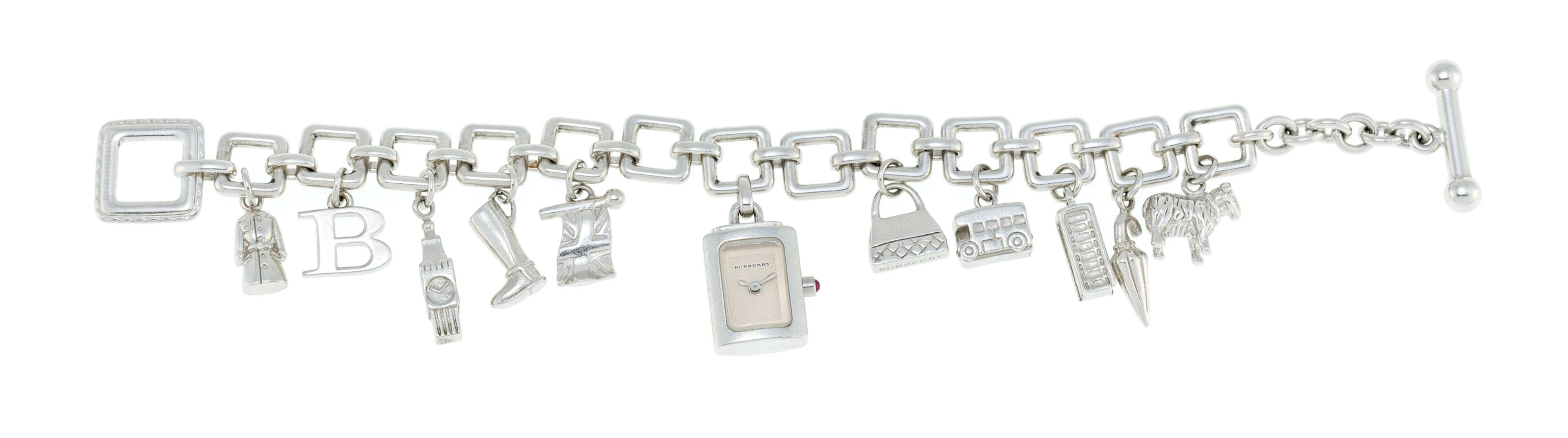 Burberry, bracelet en argent retenant 11 charms dont 1 montre, long.