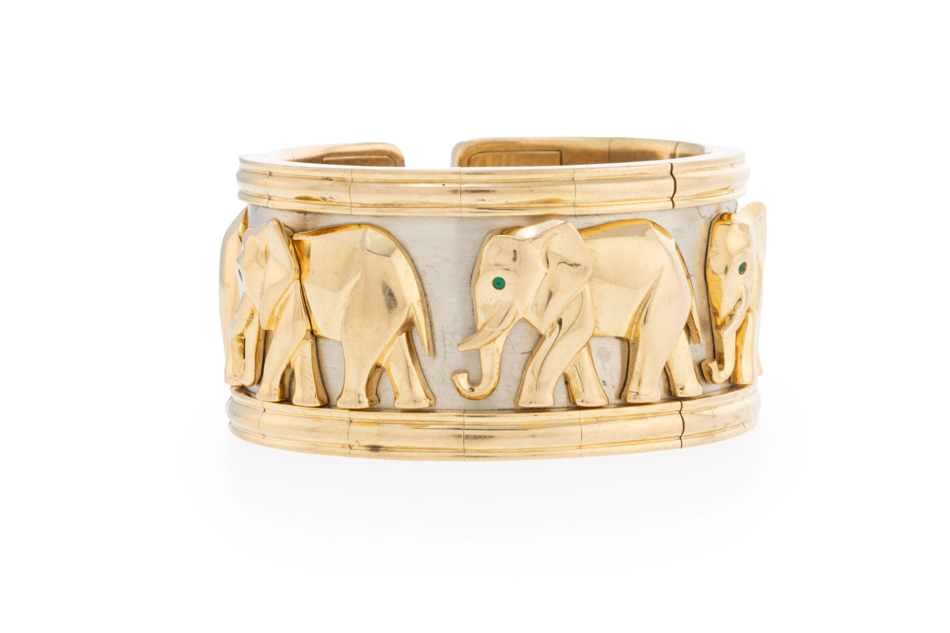 Cartier, bracelet manchette 2 ors 750 orné d'une file d'éléphants