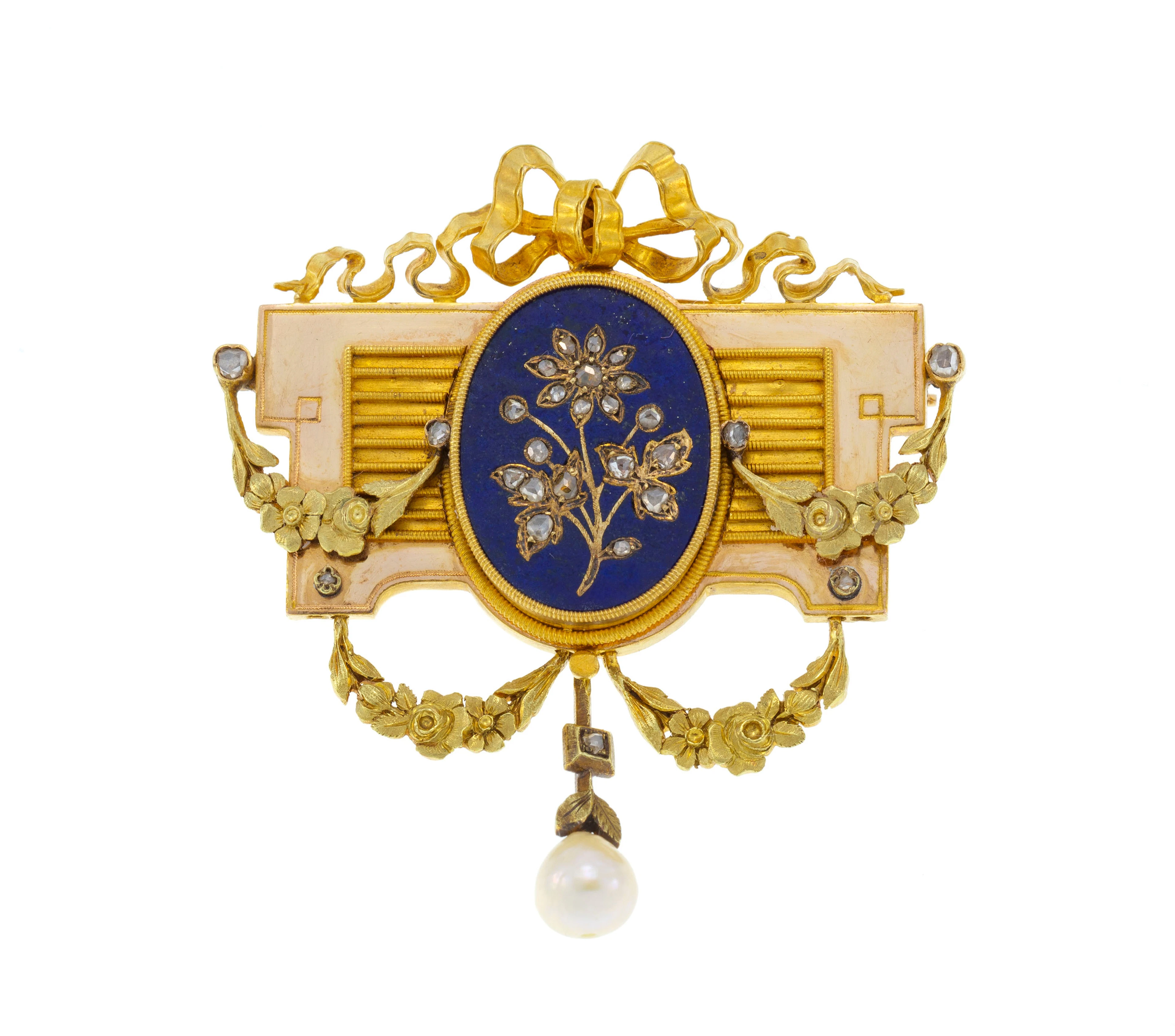 Broche XIXe s., or décorée d'un noeud, de guirlandes ciselées et d'une