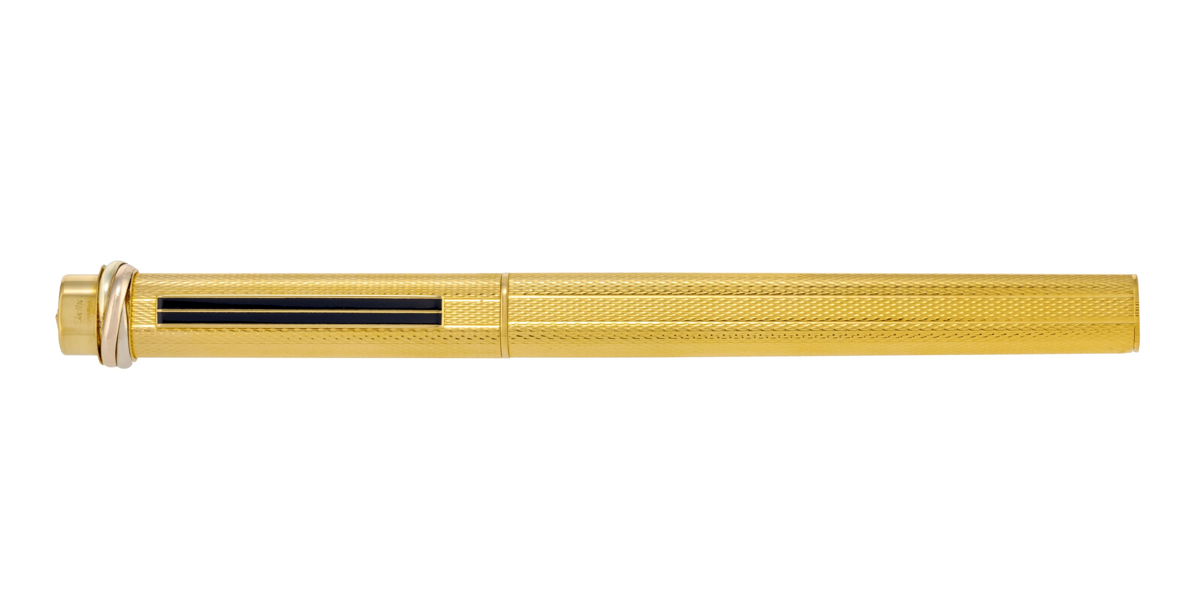 Cartier, stylo bille en métal doré avec l'agrafe en laque bleue, signé