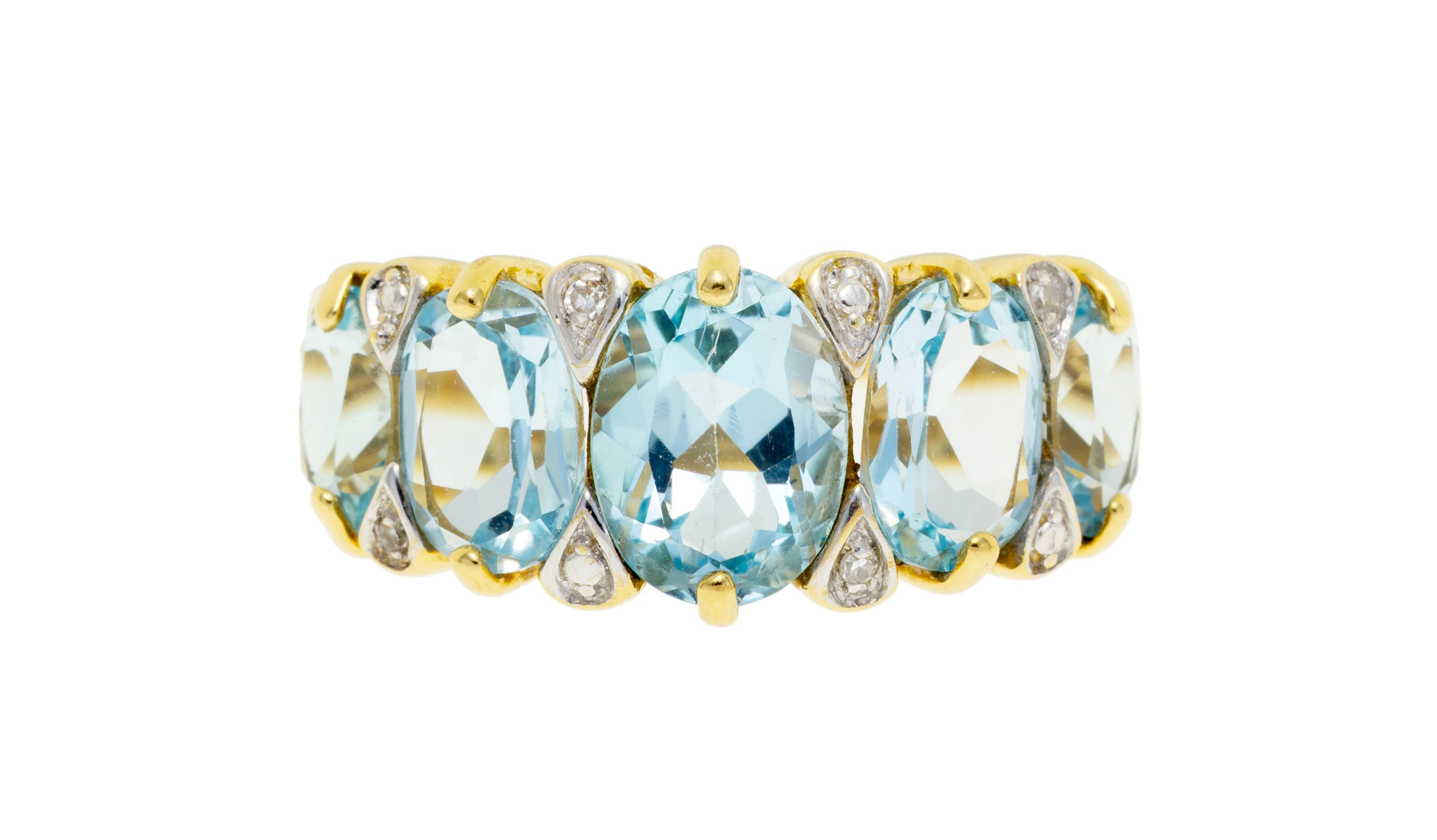 Bague or 750 sertie de topazes taille ovale en chute alternés de diamants