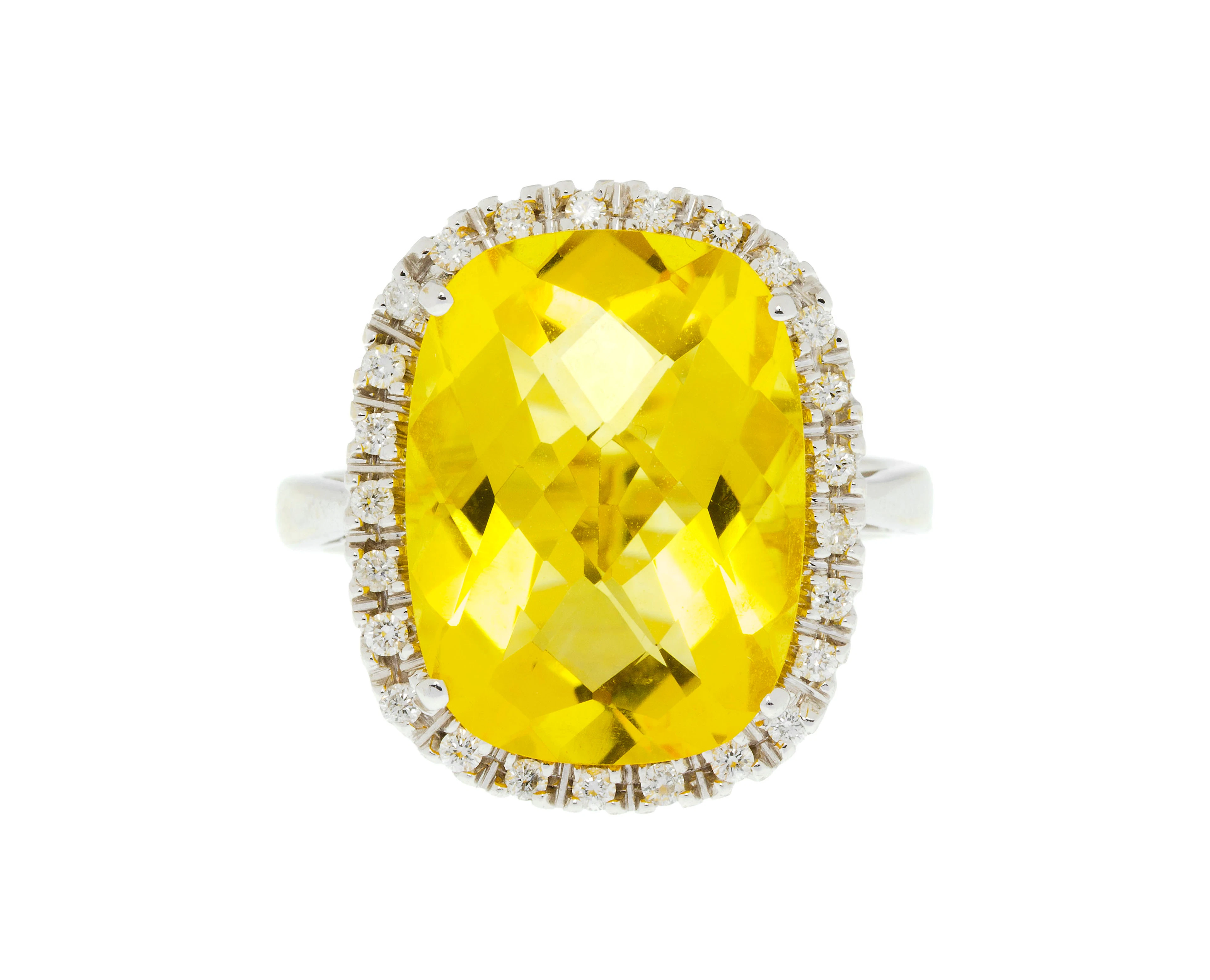 Bague or gris 750 sertie d'une citrine facettée entourée de diamants