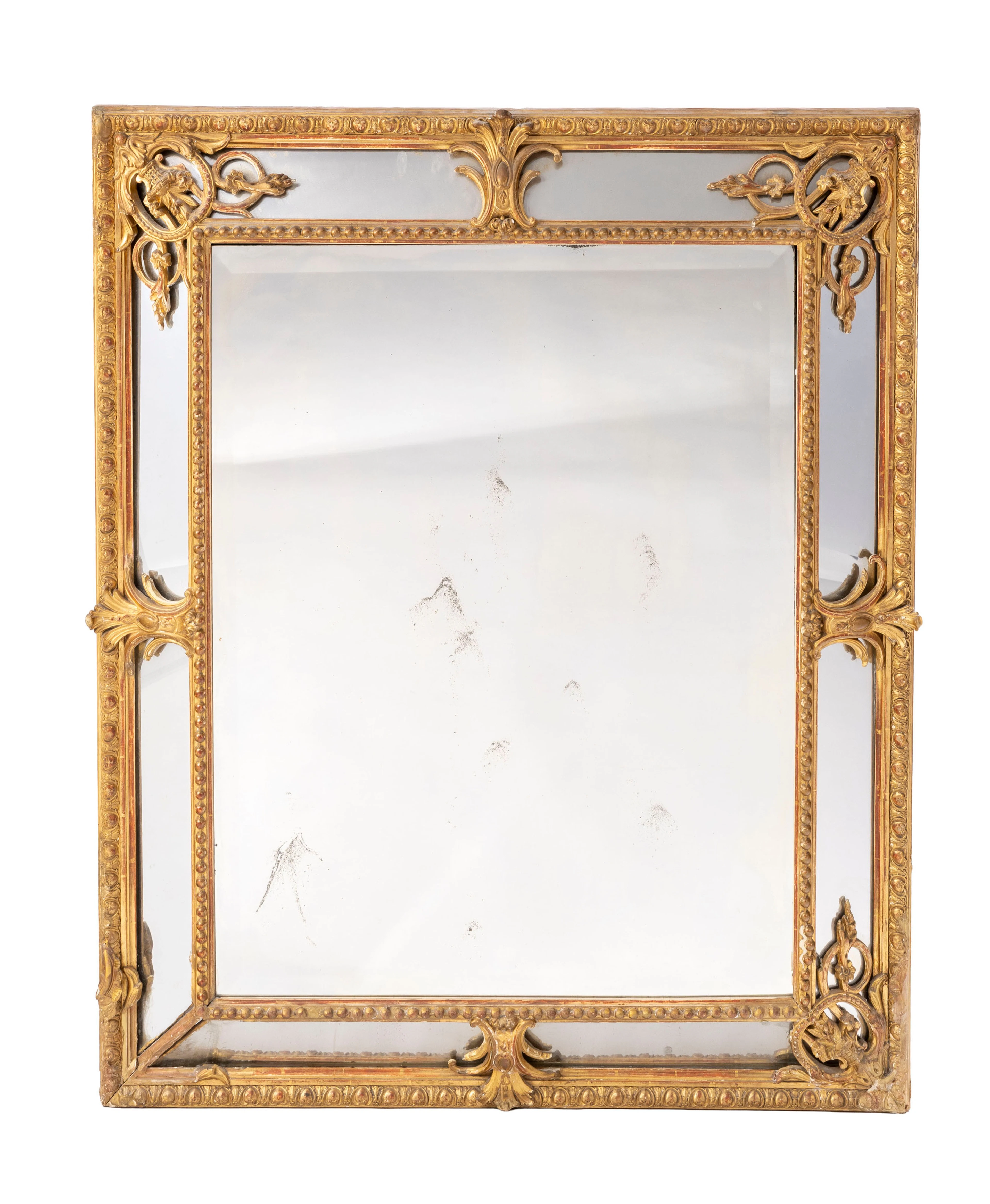Miroir à parecloses, XIXe s., en bois sculpté et doré à décor de frises