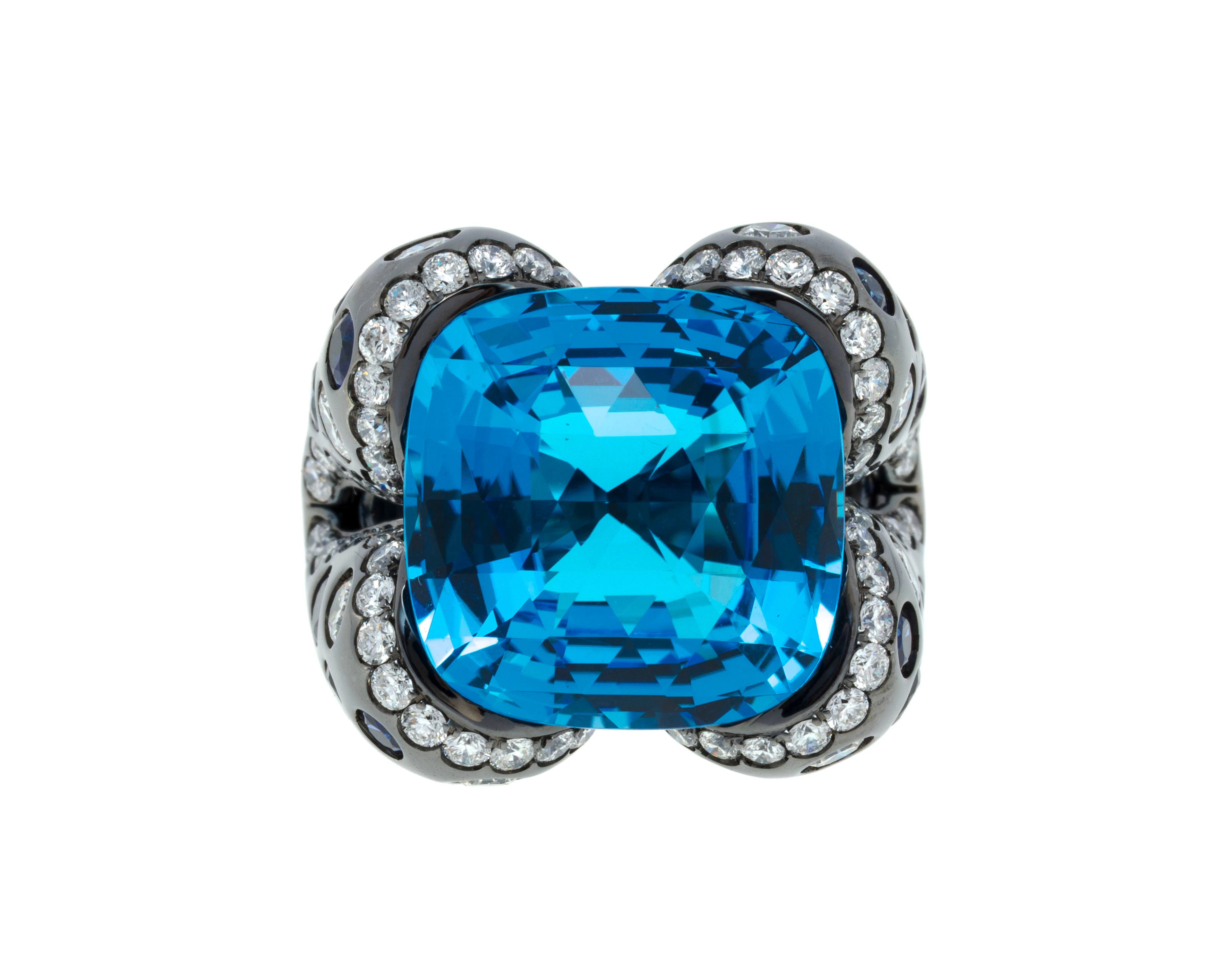 Bague or noirci 750 sertie d'une topaze facettée rehaussée de saphirs