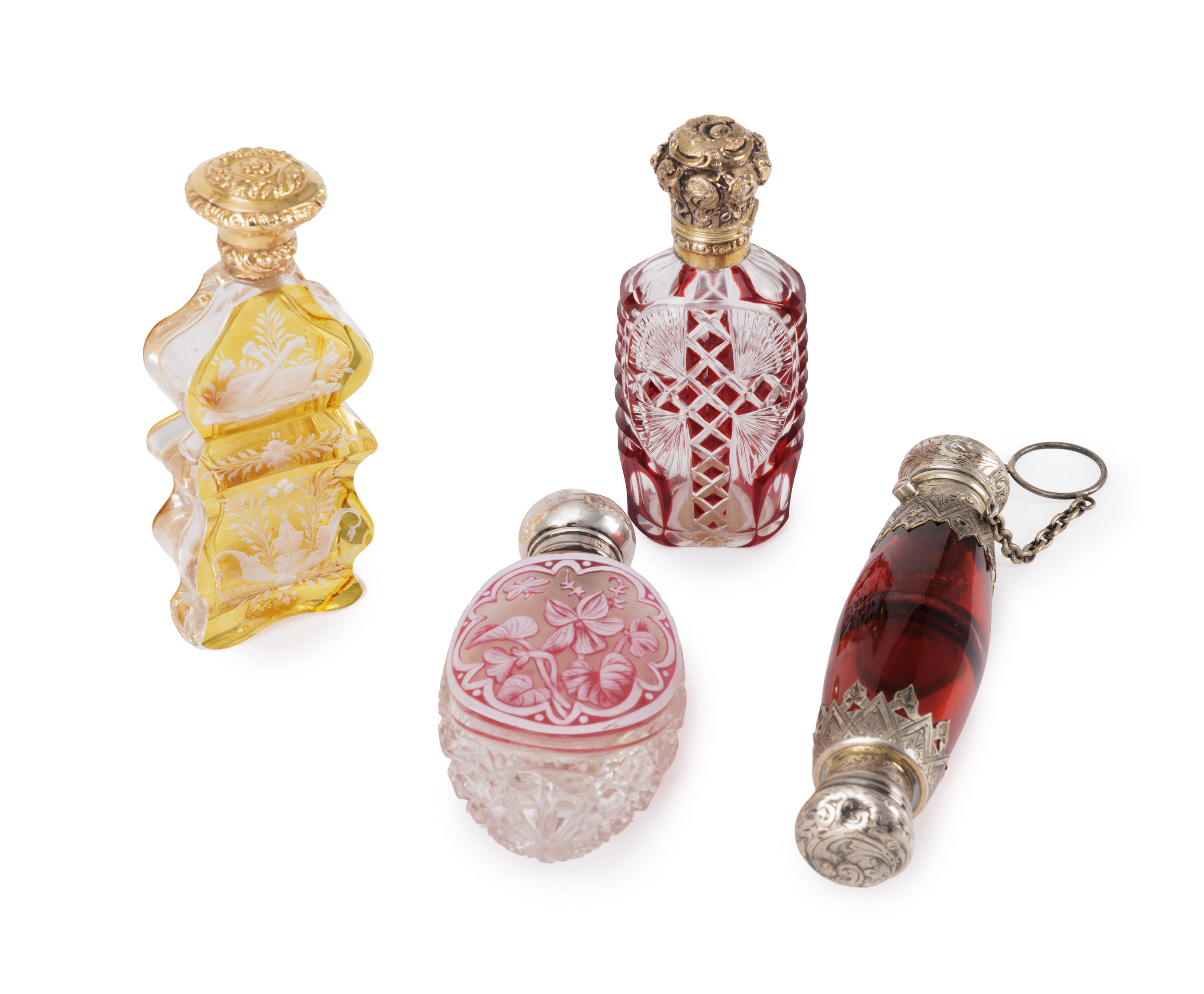 Ensemble de 4 flacons en verre taillé coloré avec capsules en or et