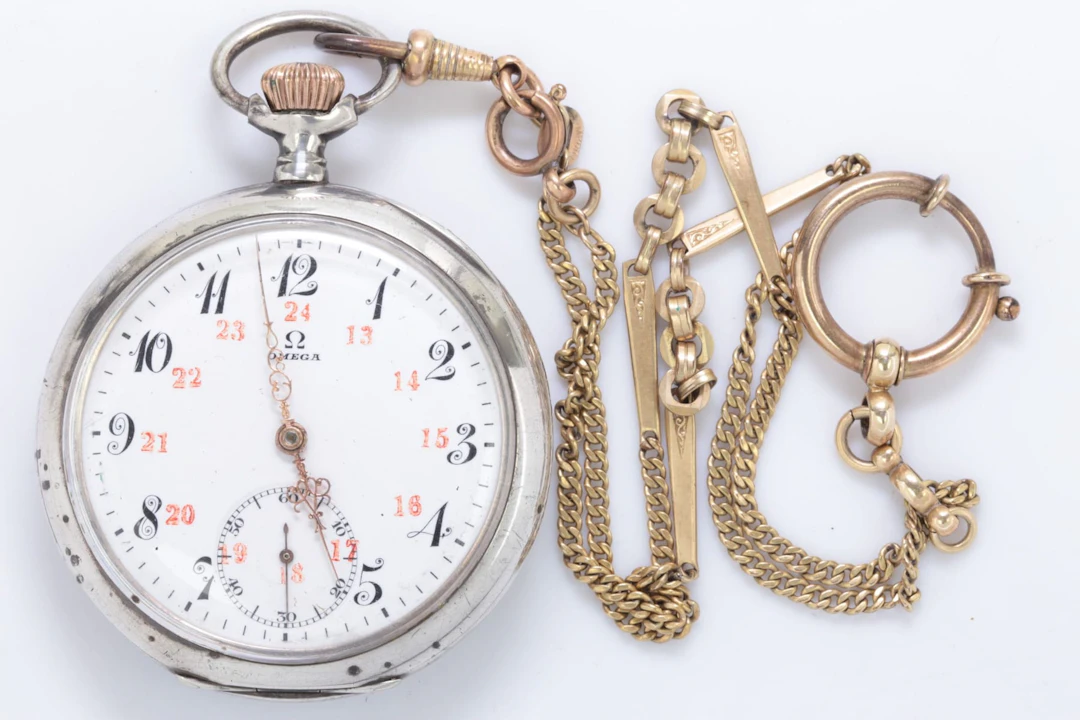 FICKUR, Omega, underhaltigt silver, 1912, samt KLOCKKEDJA, doublé