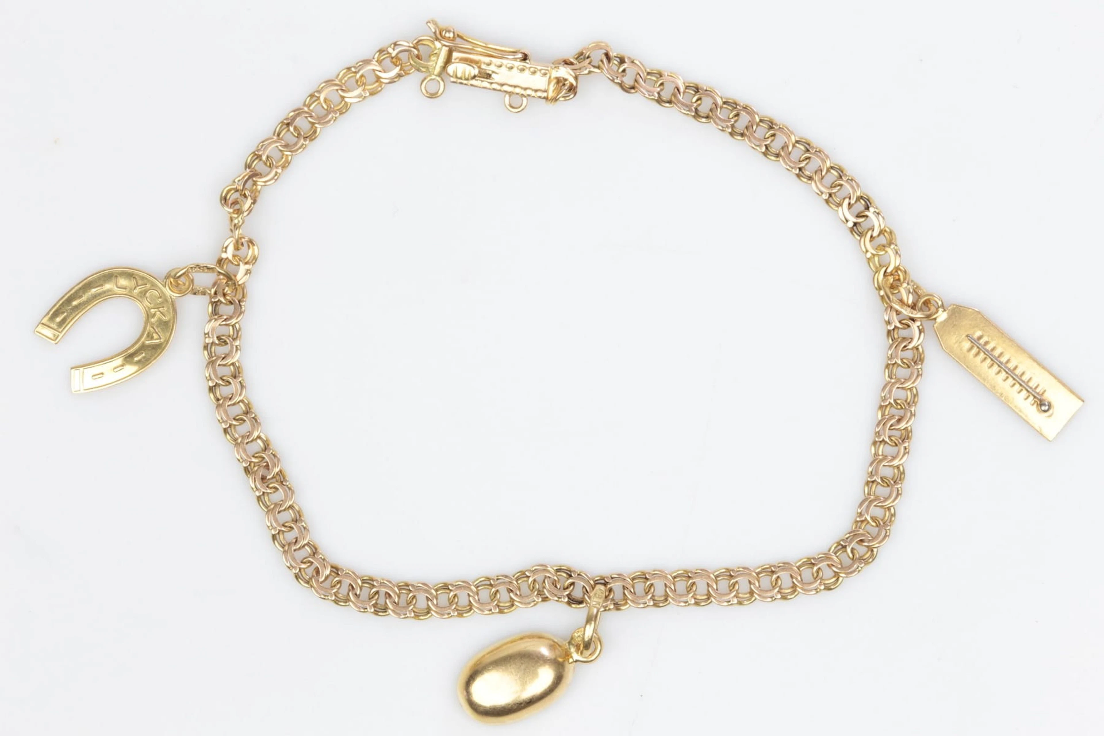 ARMBAND, bismarck, med BERLOCKER, 3 st, guld, 14 k / 18 k, tot ca 4,63 g