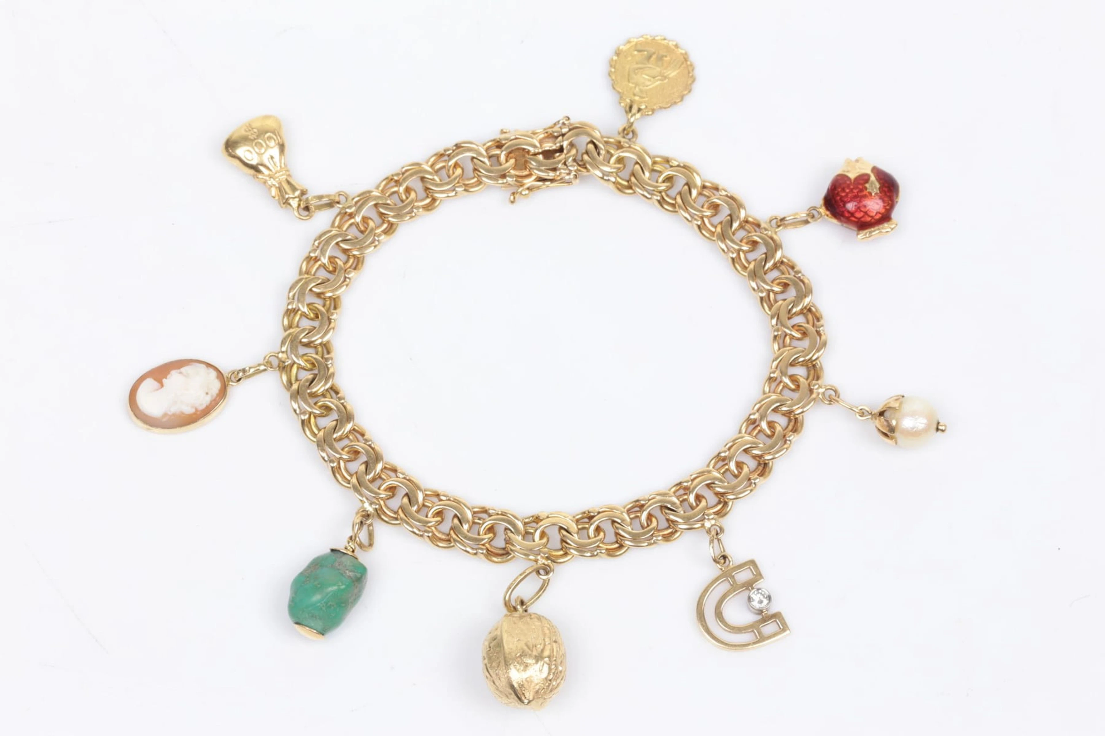 ARMBAND, bismarck, med BERLOCKER, 8 st, guld, 18 k / 14 k, ca 40,15 g