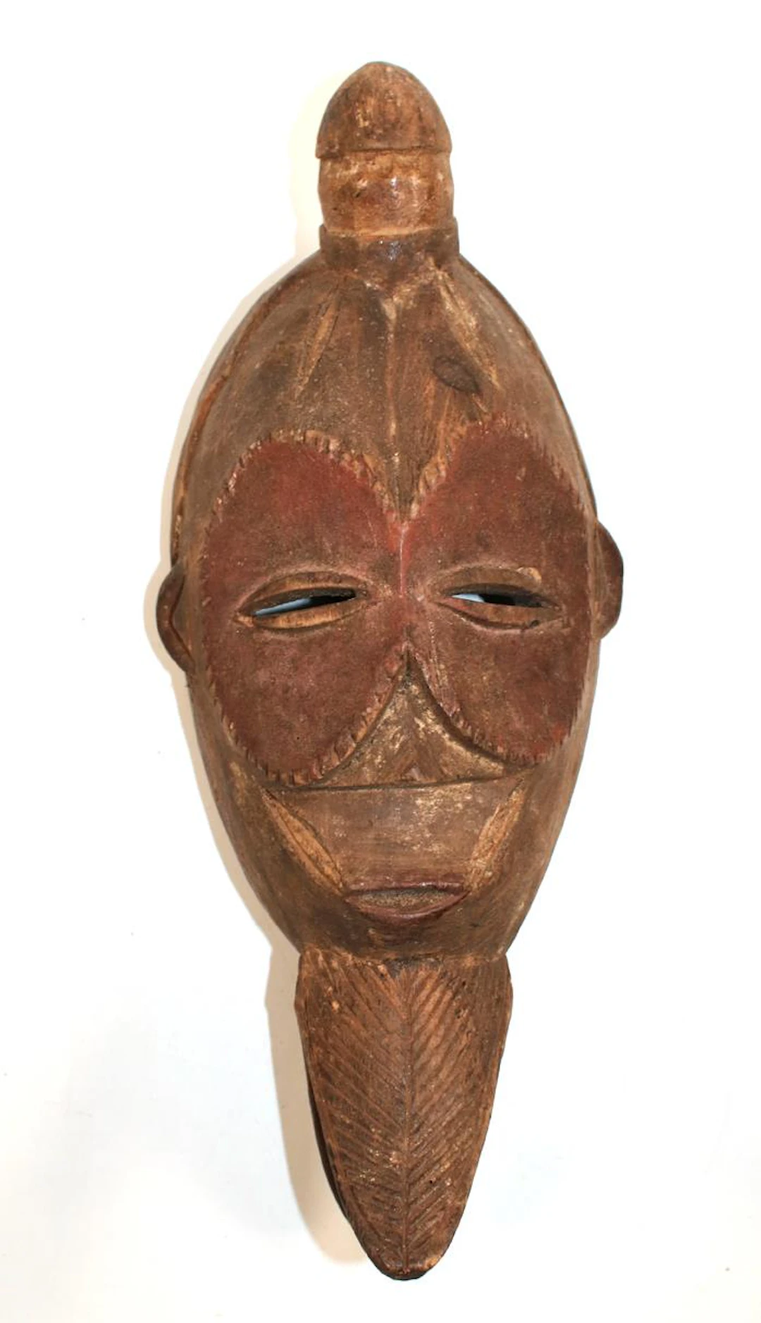 Maske wohl Senufo Elfenbeinküste. Ovoide Holzmaske mit rundem