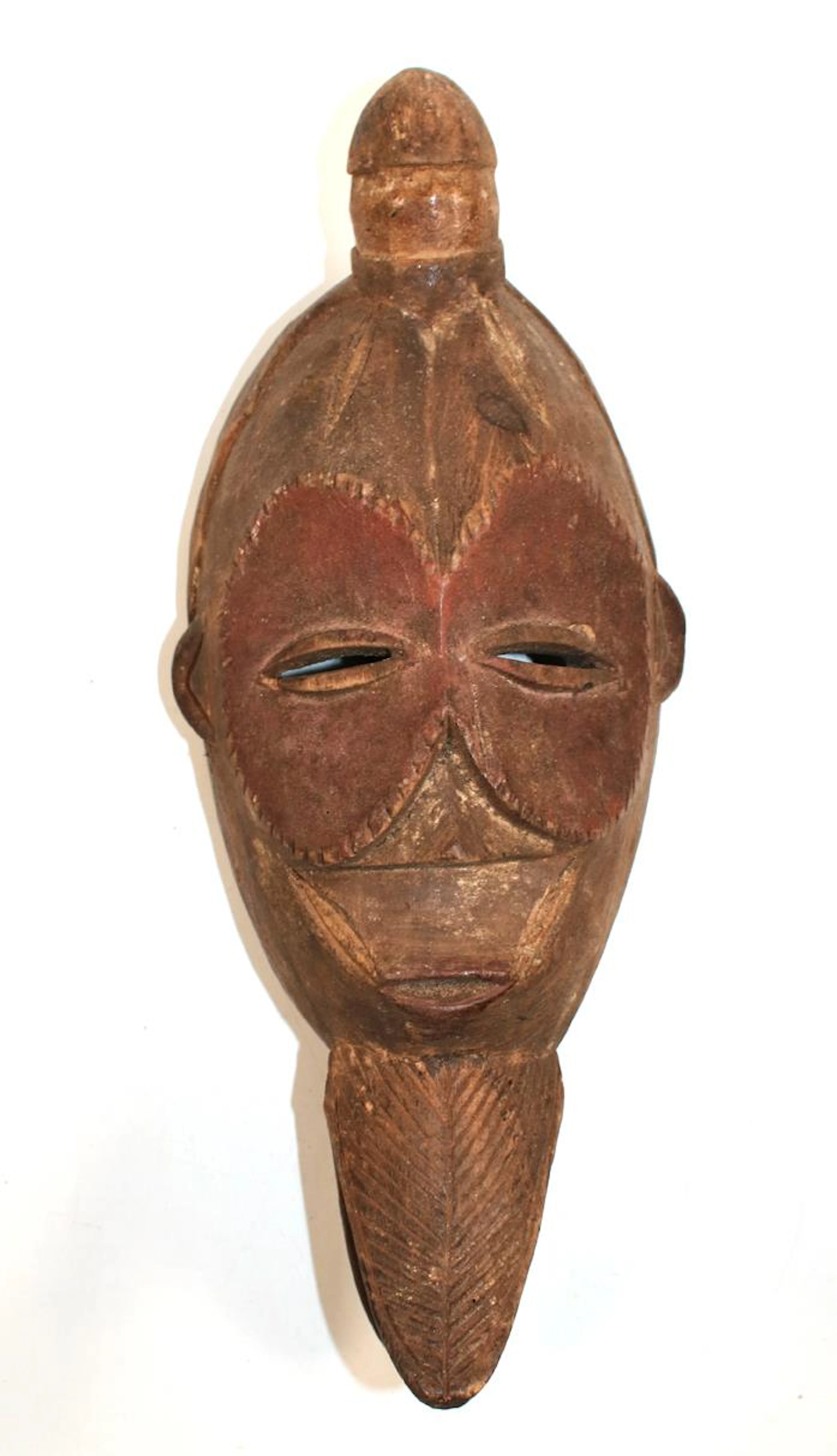 Maske wohl Senufo Elfenbeinküste. Ovoide Holzmaske mit rundem