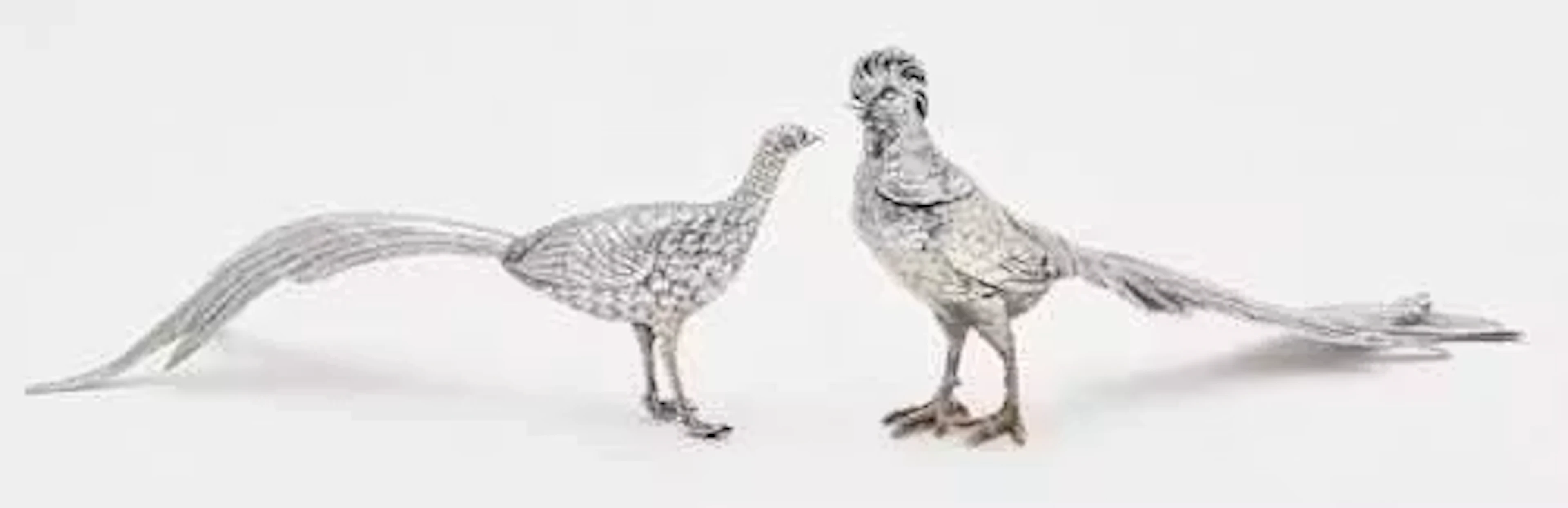 TWO SILVER SCULPTURES IN THE FORM OF PHEASANTS