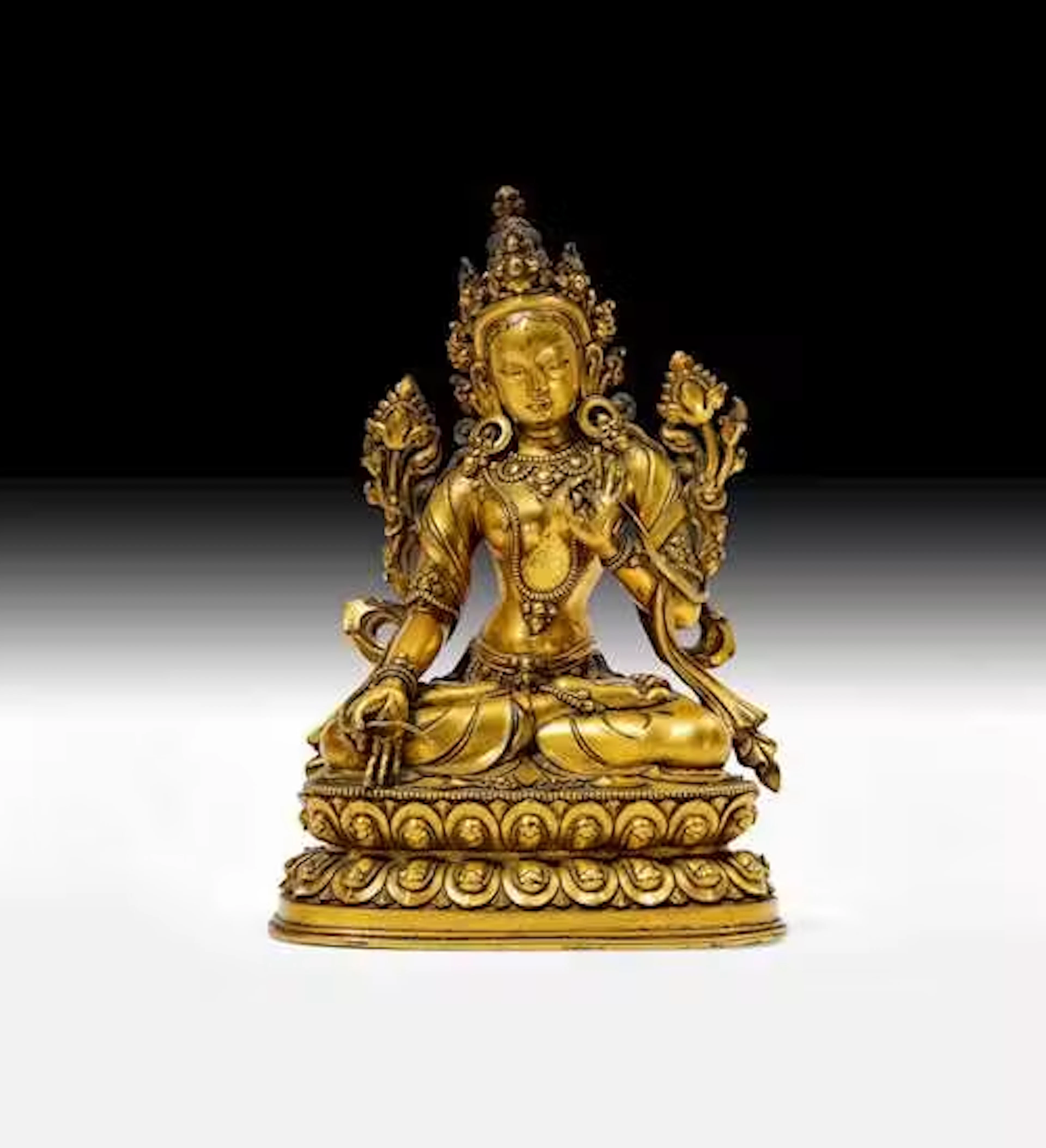 A GILT COPPER ALLOY FIGURE OF THE WHITE TARA
