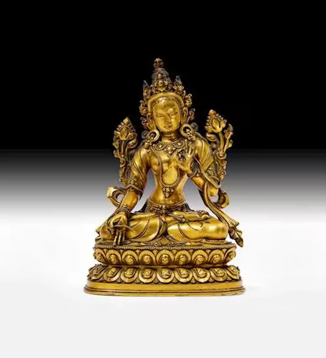 A GILT COPPER ALLOY FIGURE OF THE WHITE TARA