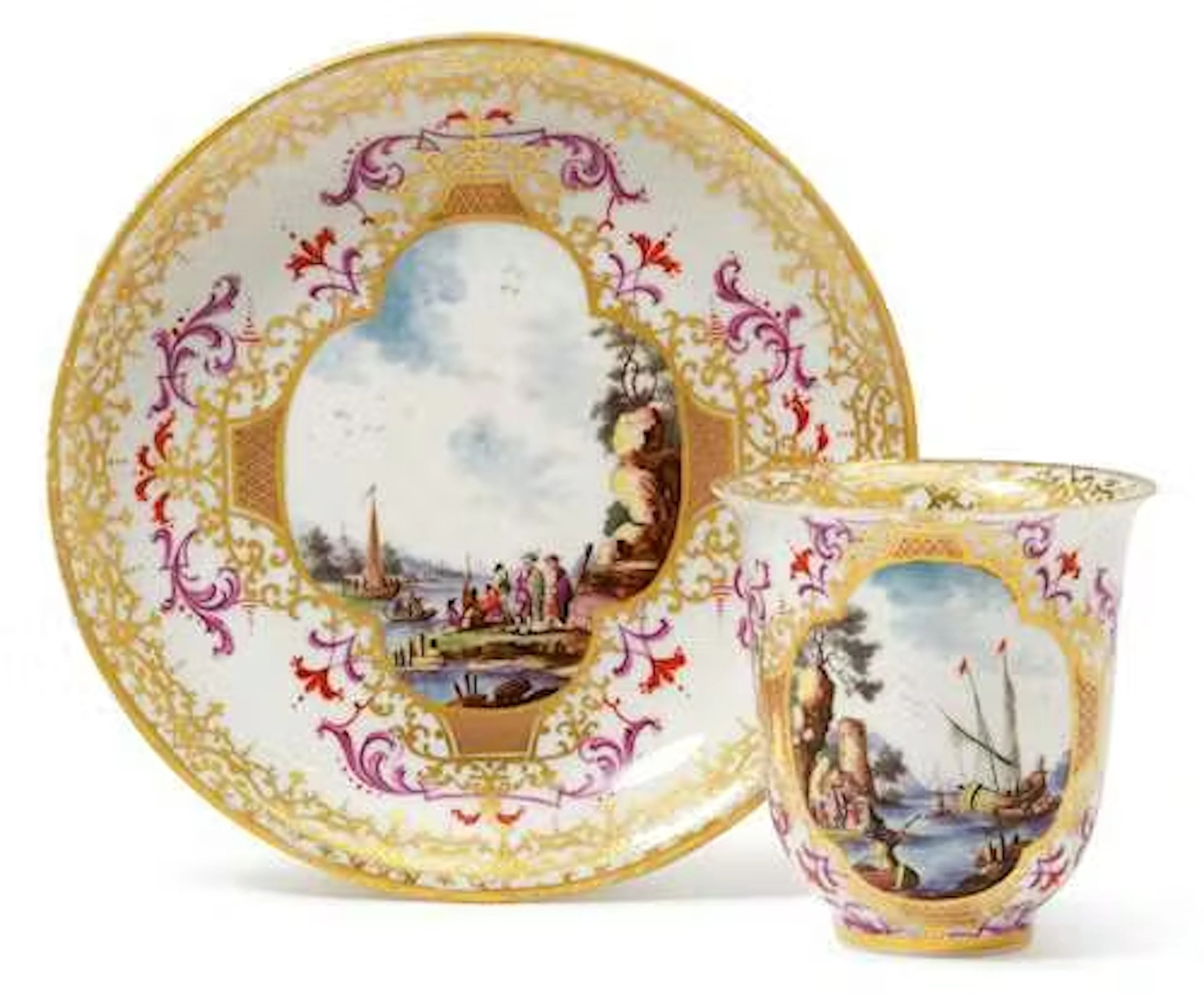 A CUP AND SAUCER WITH MERCHANT SCENES