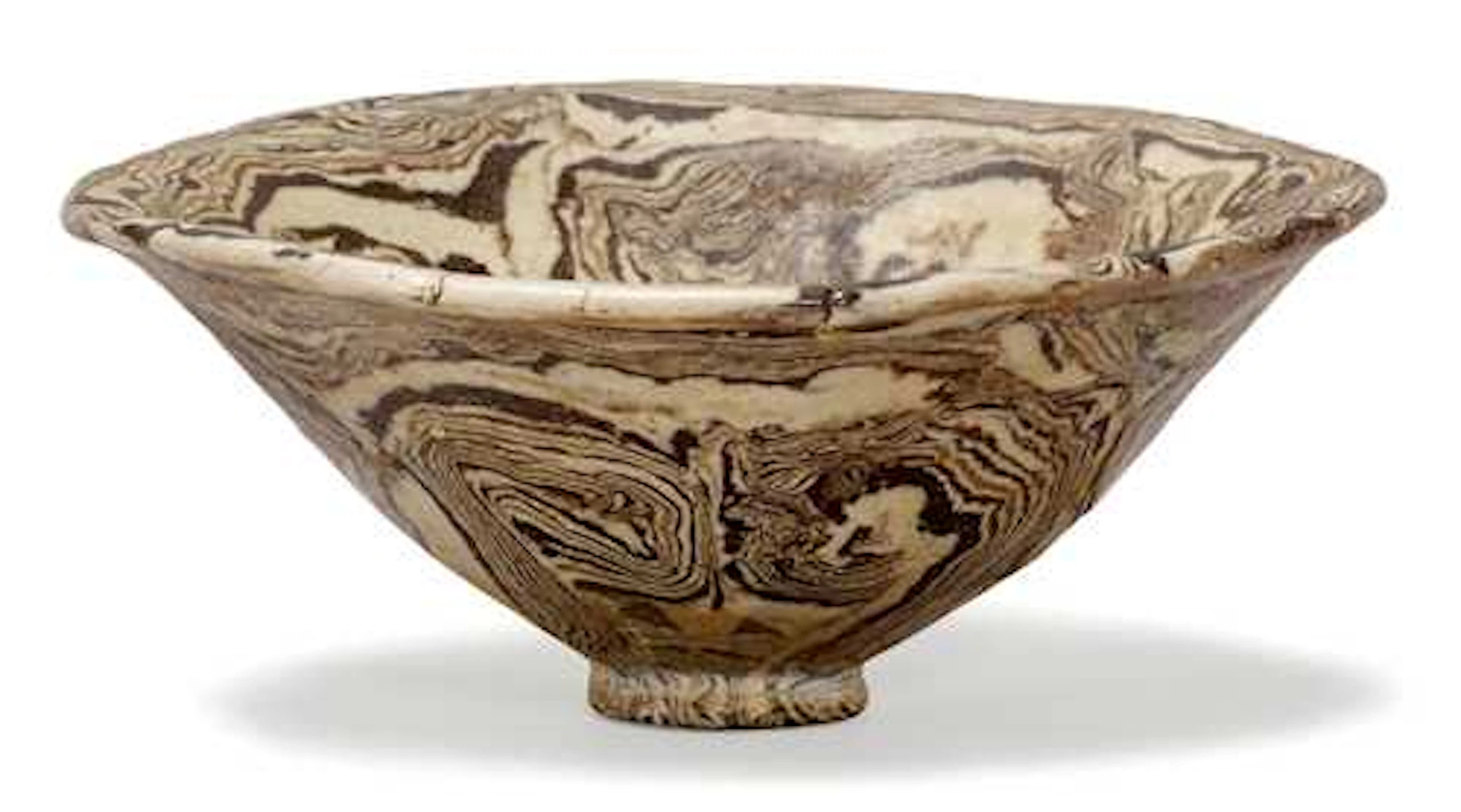 A MARBLED CLAY BOWL.
