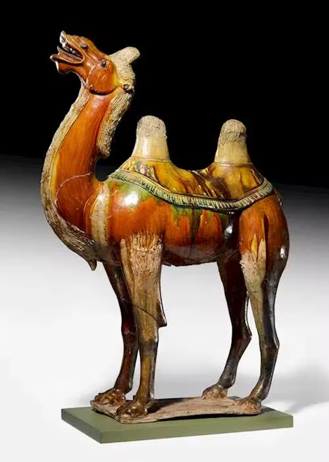 A VERY LARGE SANCAI-GLAZED POTTERY FIGURE OF A BACTRIAN CAMEL