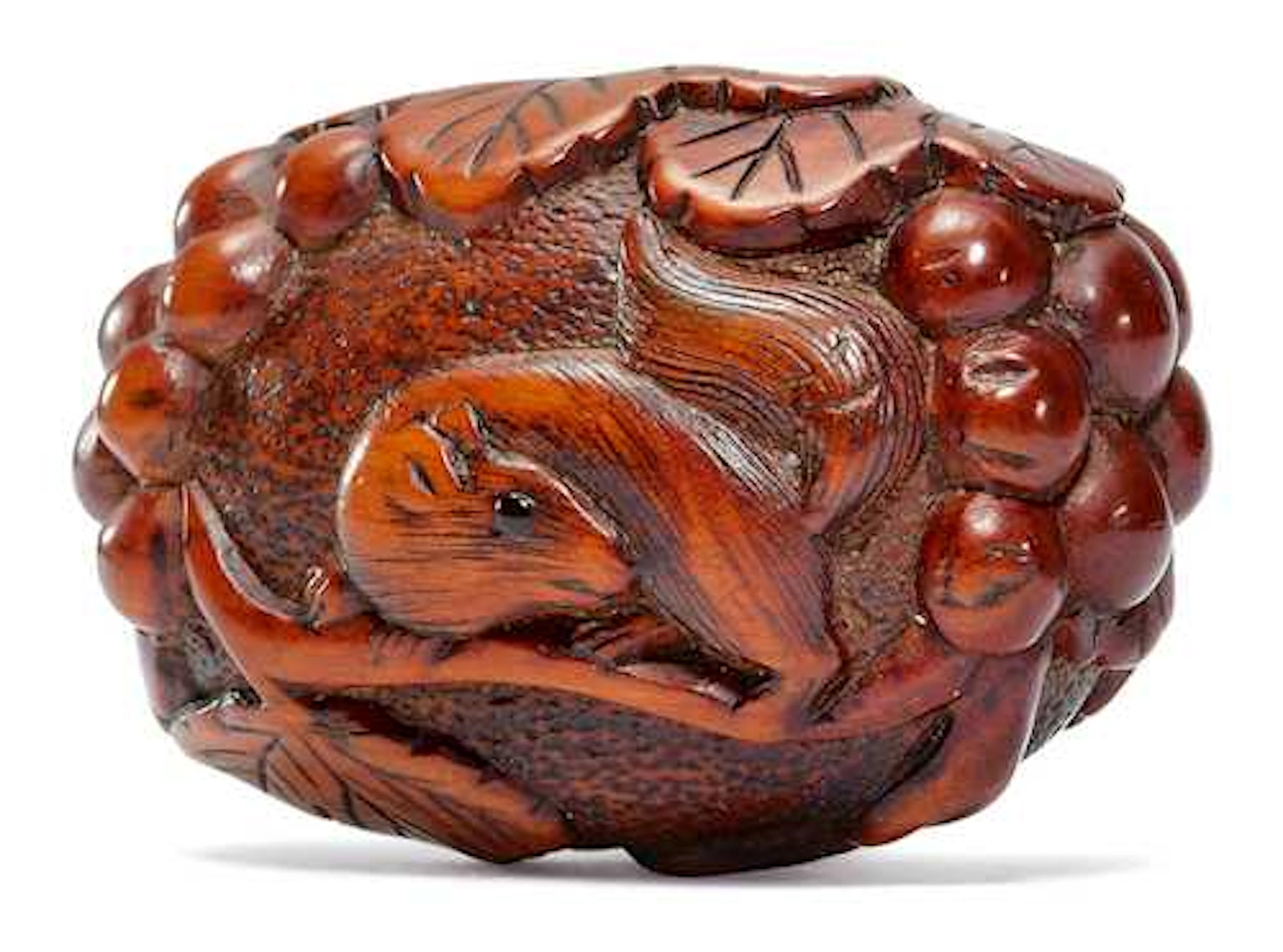 A BOXWOOD NETSUKE WITH SQUIRREL