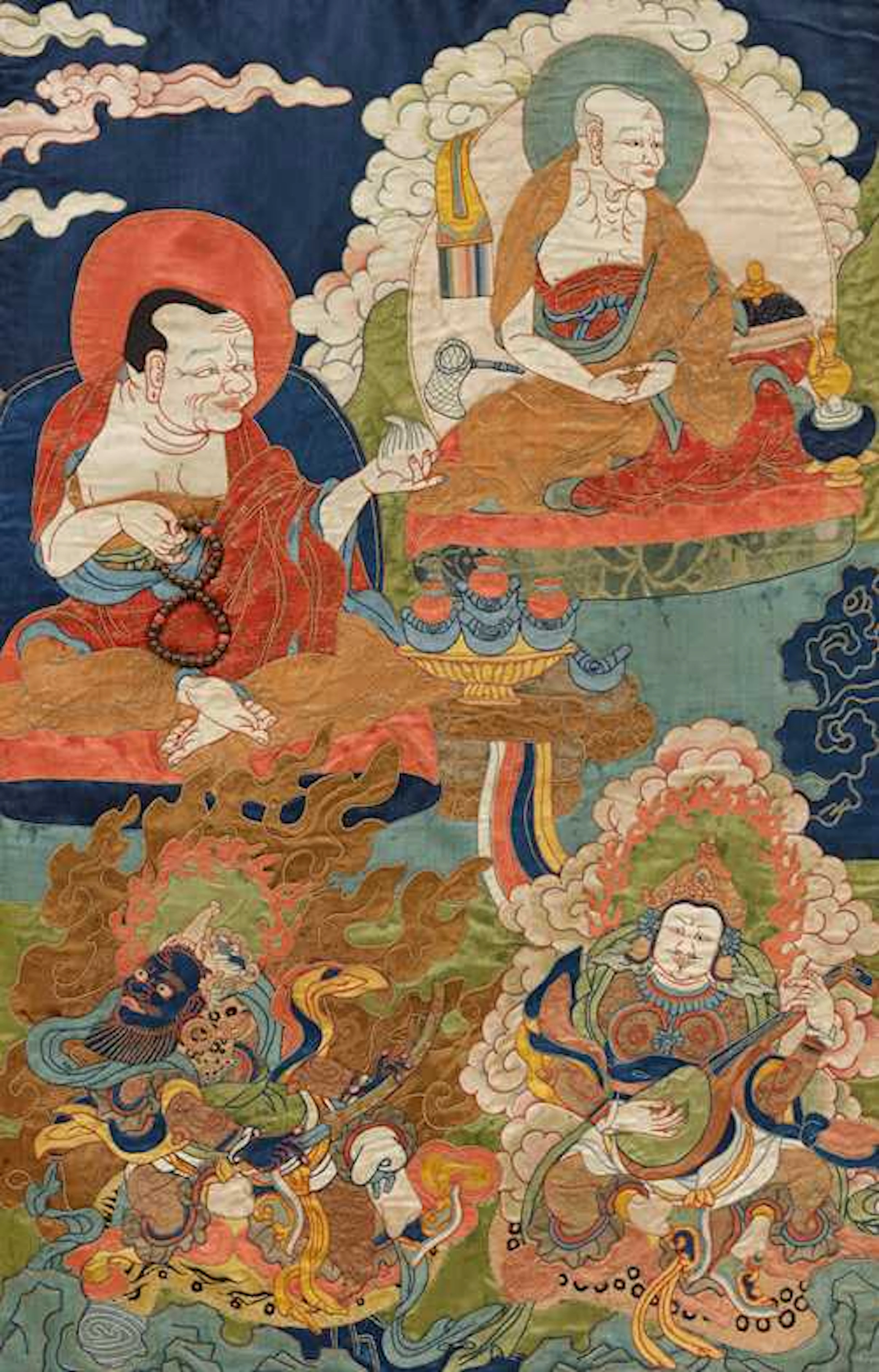 A SILK APPLIQUÉ THANGKA OF ARHATS AND HEAVENLY KINGS.