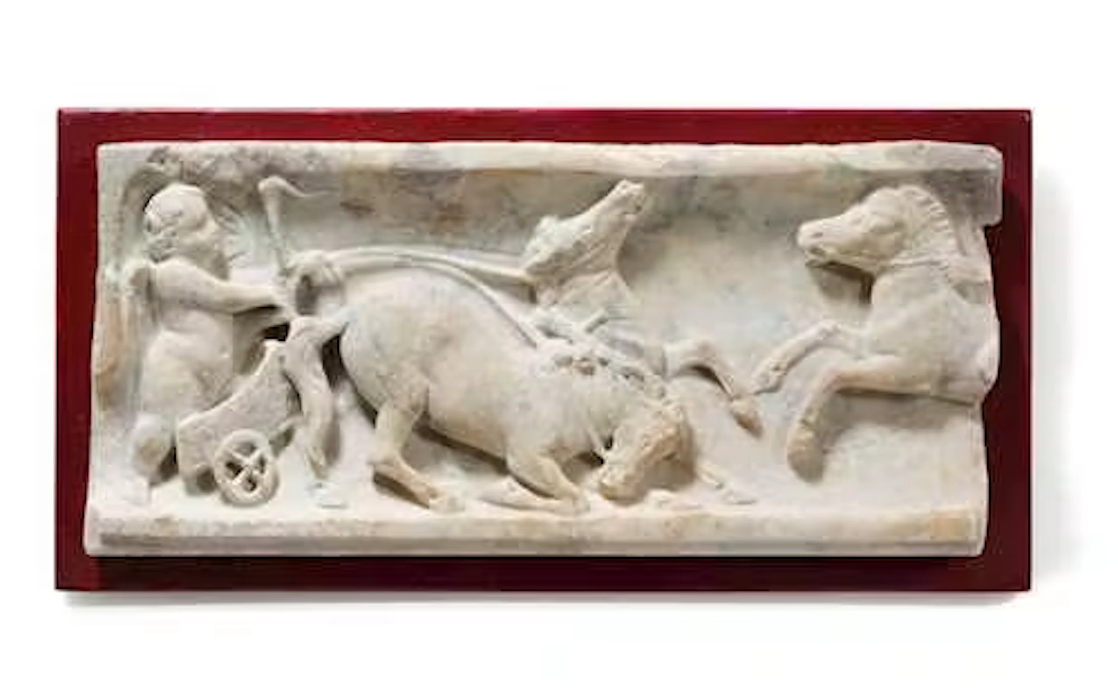 FRAGMENT OF AN EROTES SARCOPHAGUS WITH A CHARIOT RACE