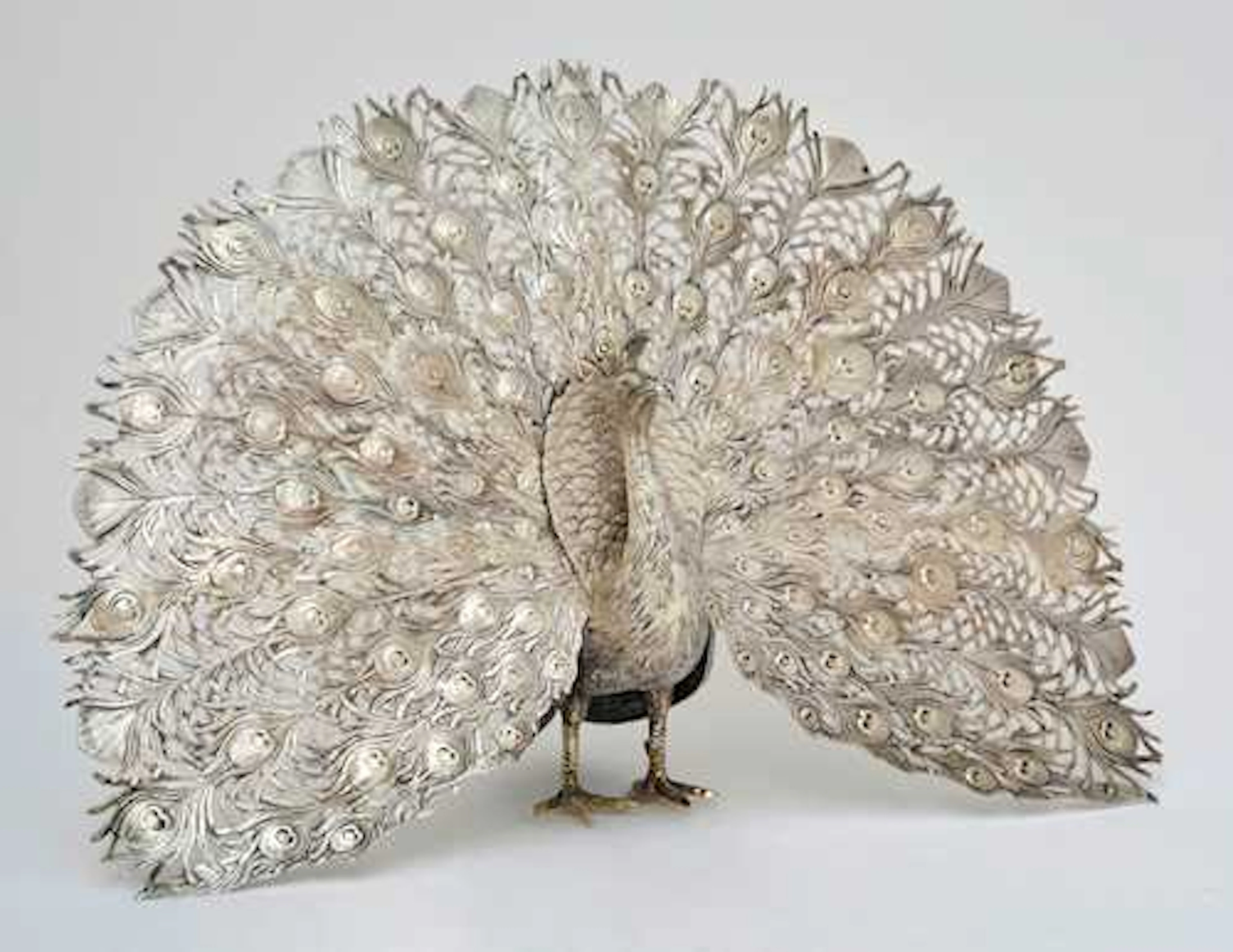SILVER SCULPTURE IN THE SHAPE OF A PEACOCK