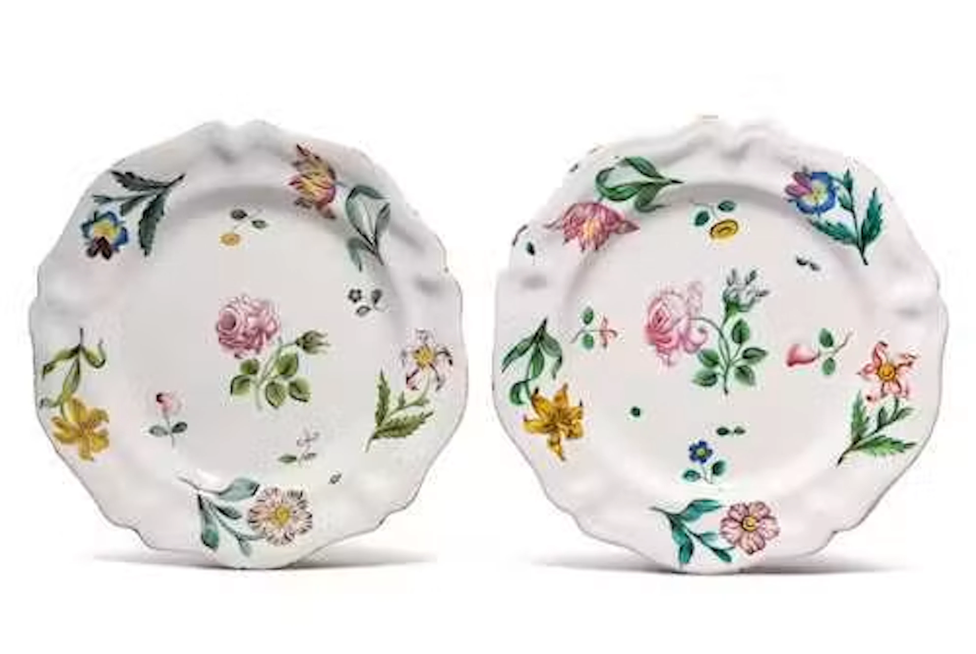 TWO PLATES WITH WOODCUT FLOWER DECORATION