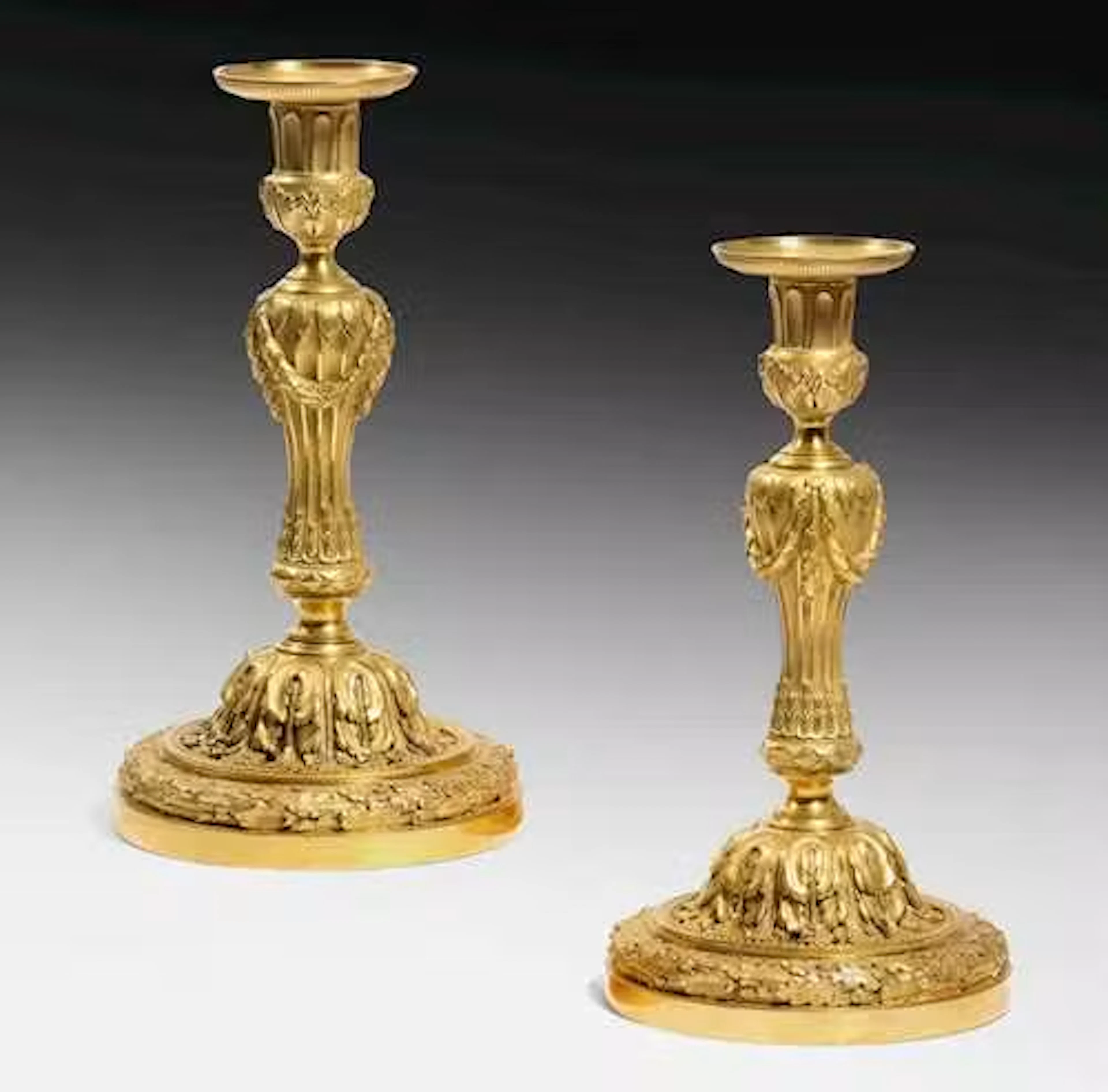 A PAIR OF MAGNIFICENT GILT CANDLESTICKS